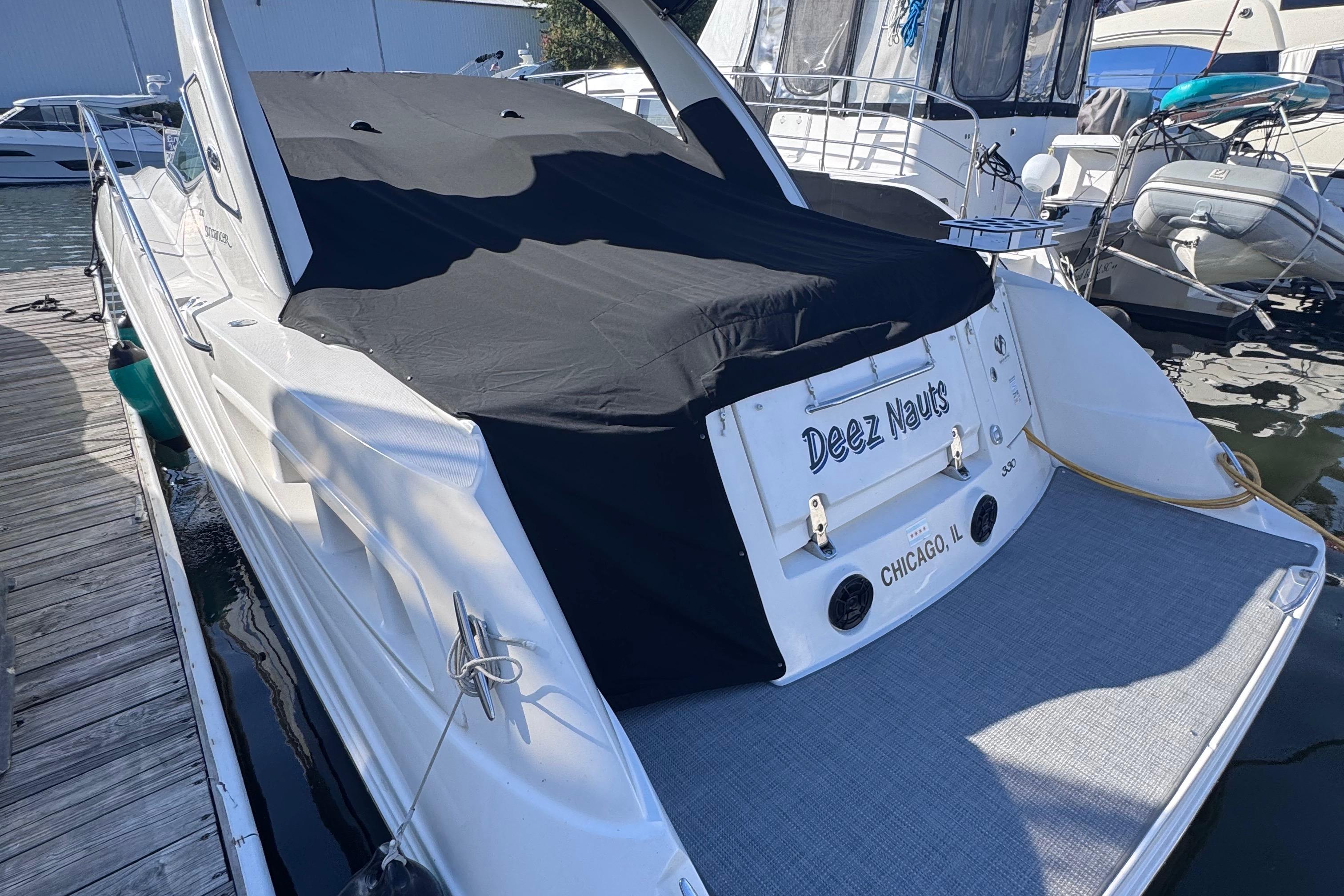 2008 Sea Ray 350 Sundancer docked, covered, with "Deez Nauts" nameplate, Chicago.
