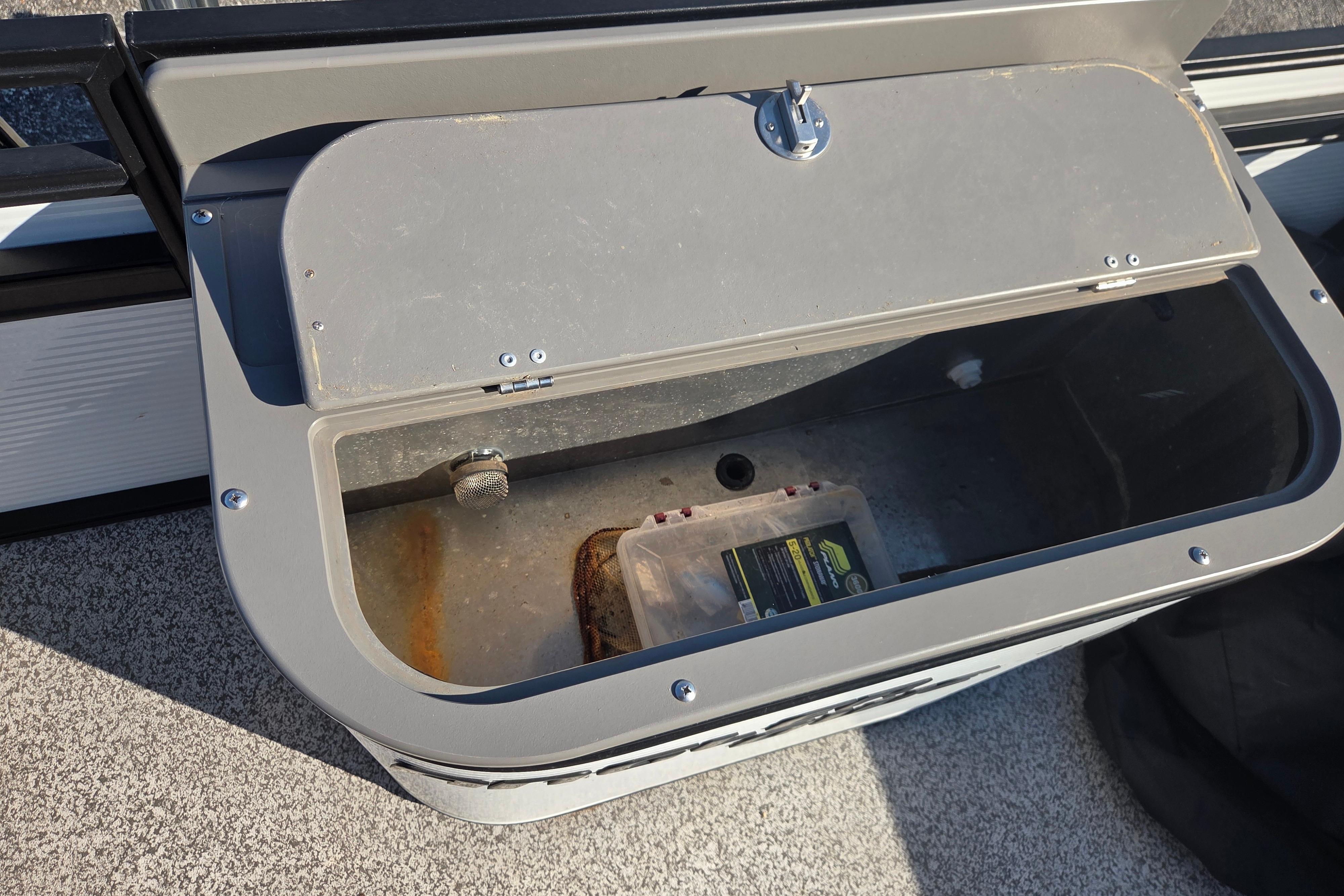 Open storage compartment on 2024 Angler Qwest 8526 Pro Troll boat.