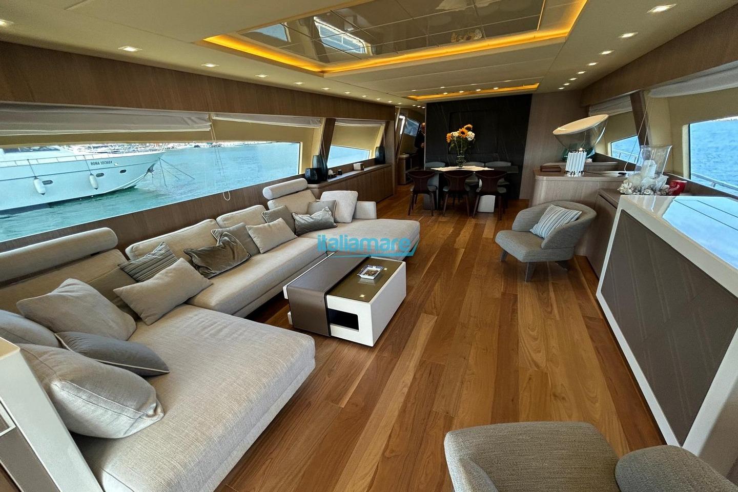 Luxurious interior of 2009 PerMare Amer 92 yacht with elegant seating and wooden flooring.