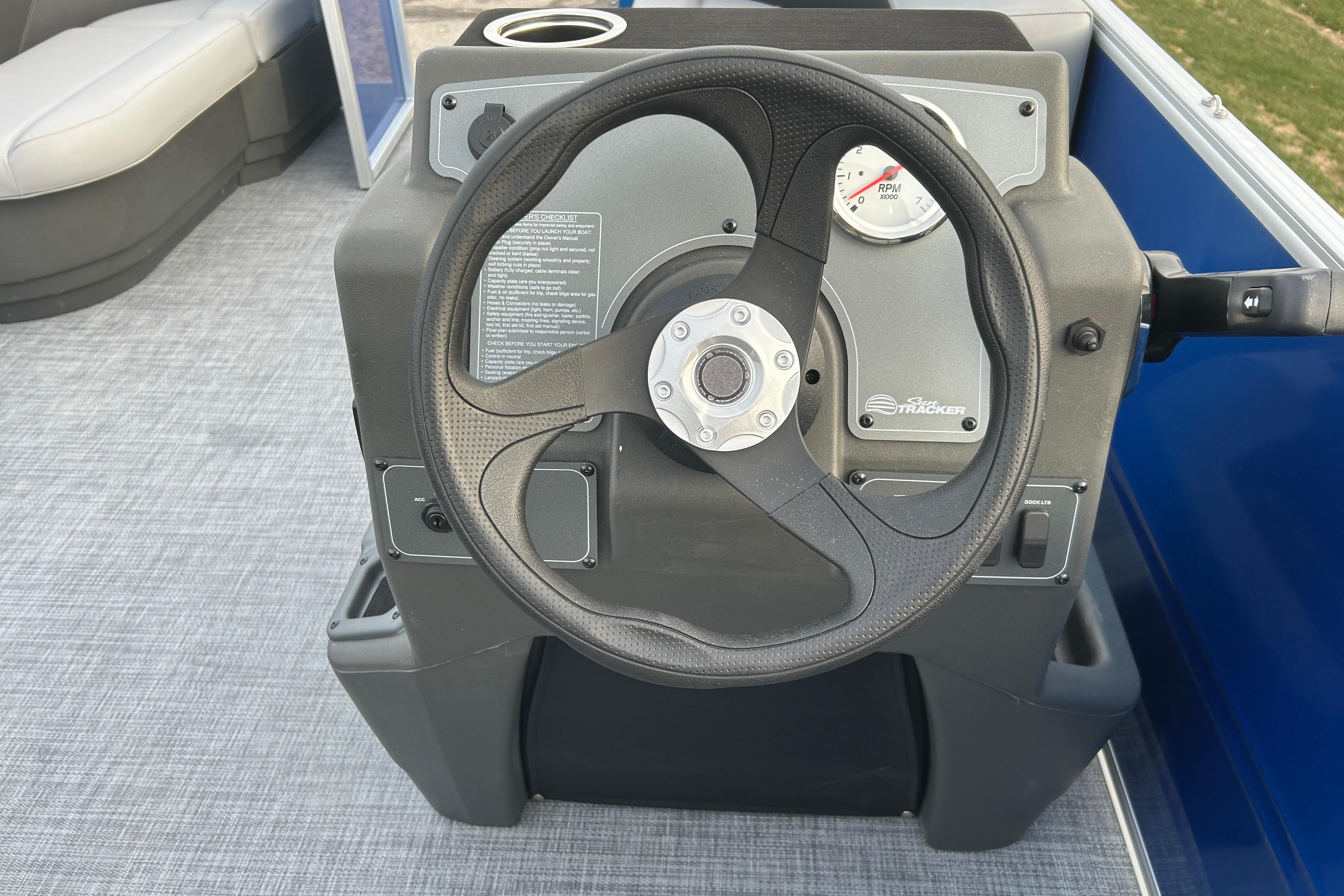 Steering console of 2026 Sun Tracker Party Barge 16 DLX pontoon boat.