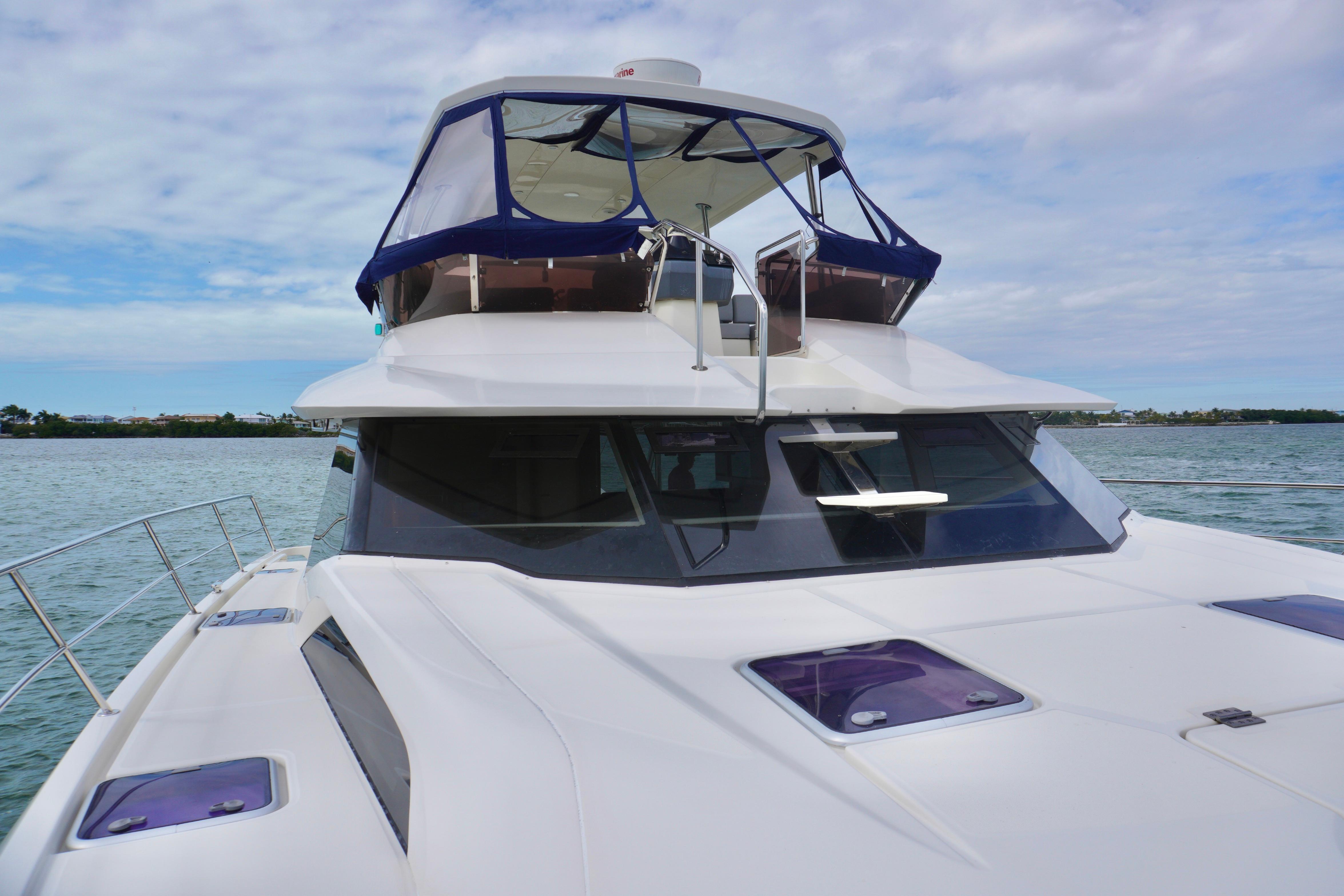 2017 Aquila 44 Yacht on calm waters under a partly cloudy sky.