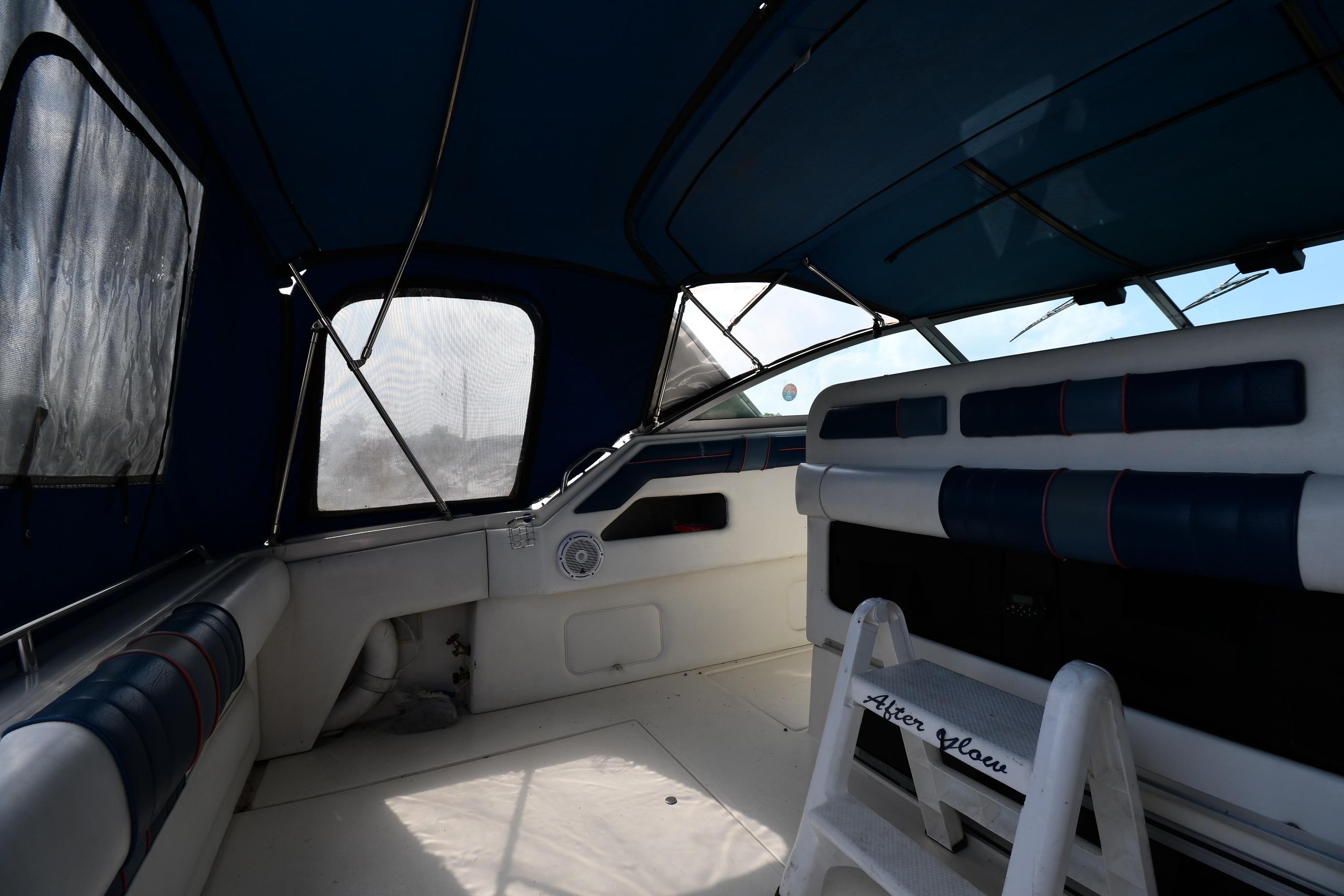 Interior view of a 1993 Sea Ray 300 Sundancer boat with blue and white seating.