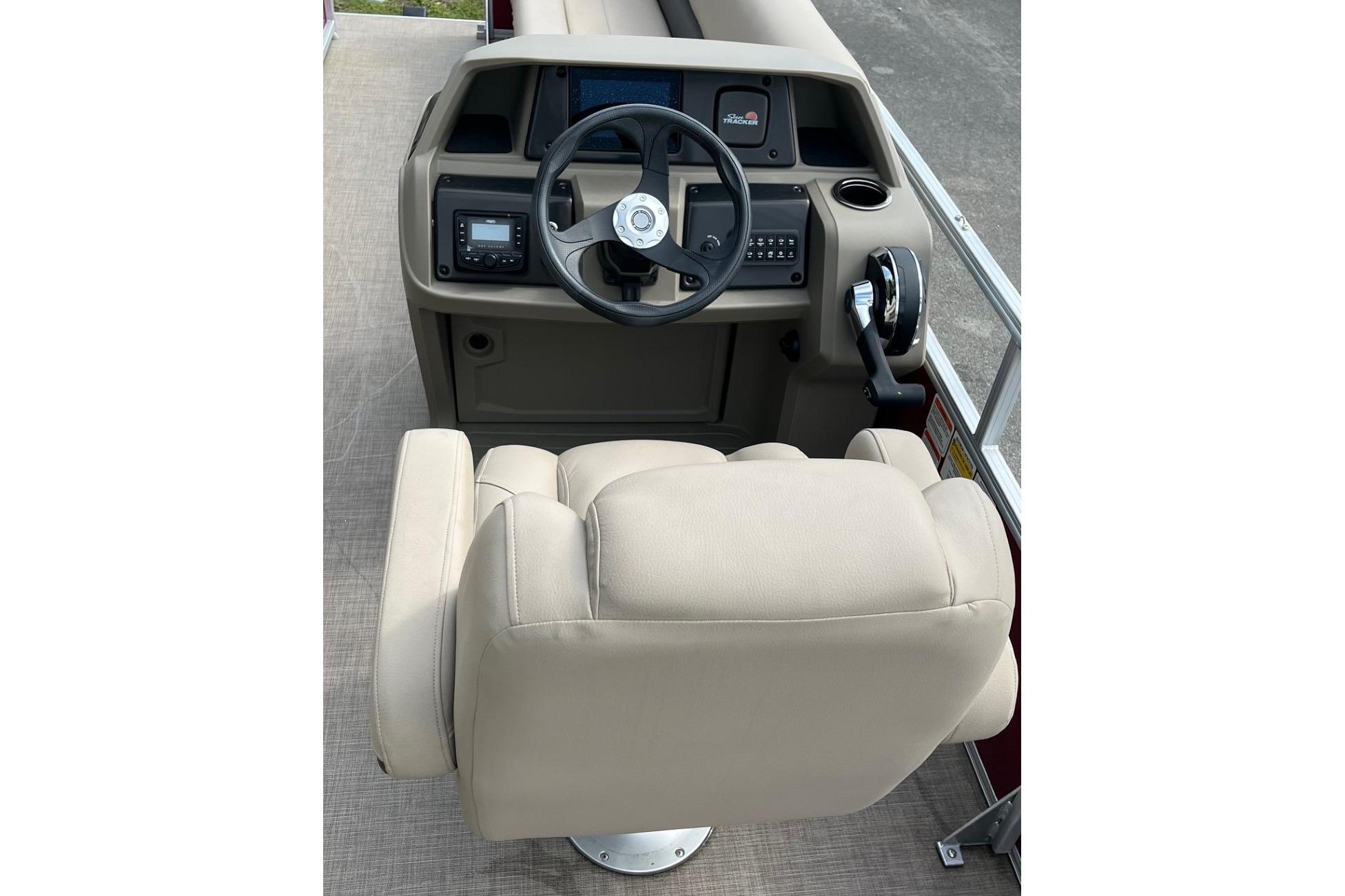 Captain's chair and helm of 2025 Sun Tracker Party Barge 18 DLX pontoon boat.