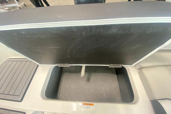 2024 Starcraft SVX 190 boat storage compartment with open lid.