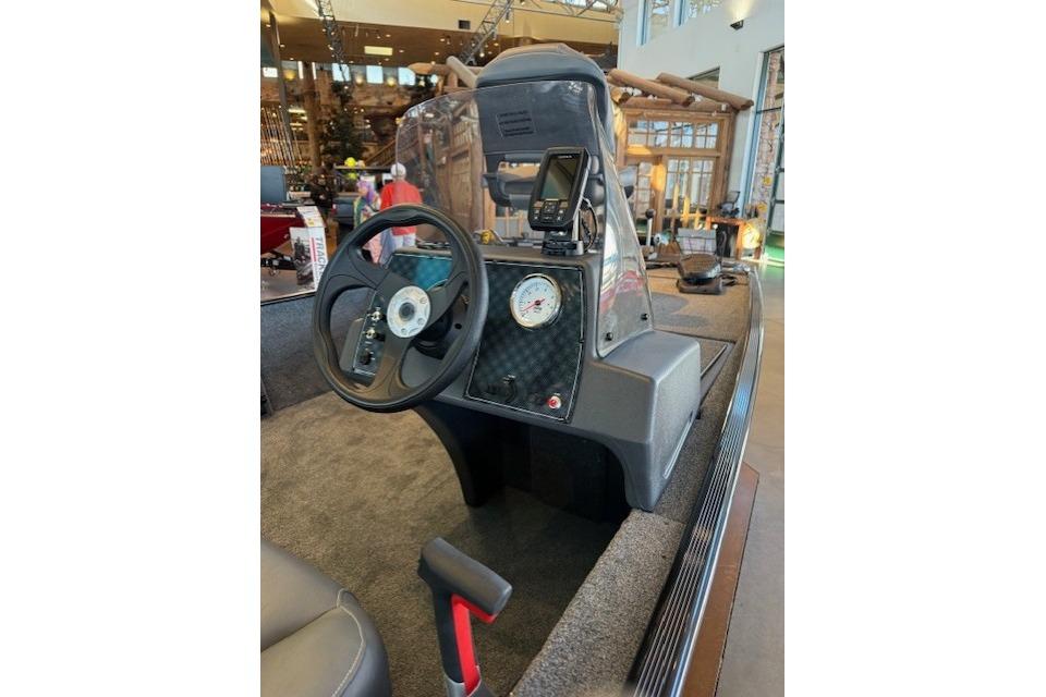 2026 Tracker Bass Tracker Classic XL boat dashboard with steering wheel and gauges.