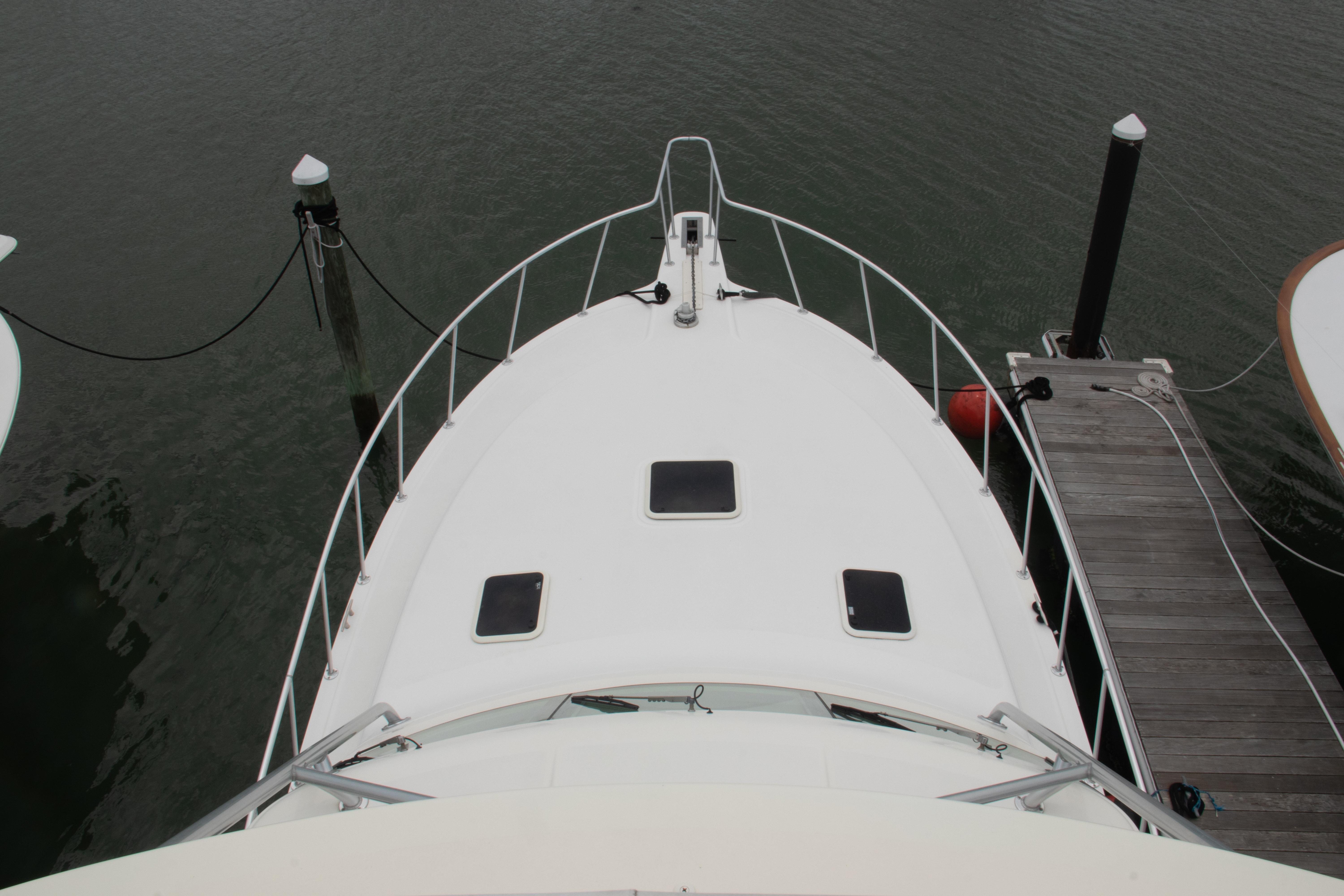 Top view of 2016 Henriques 42 Express Hardtop docked at marina.