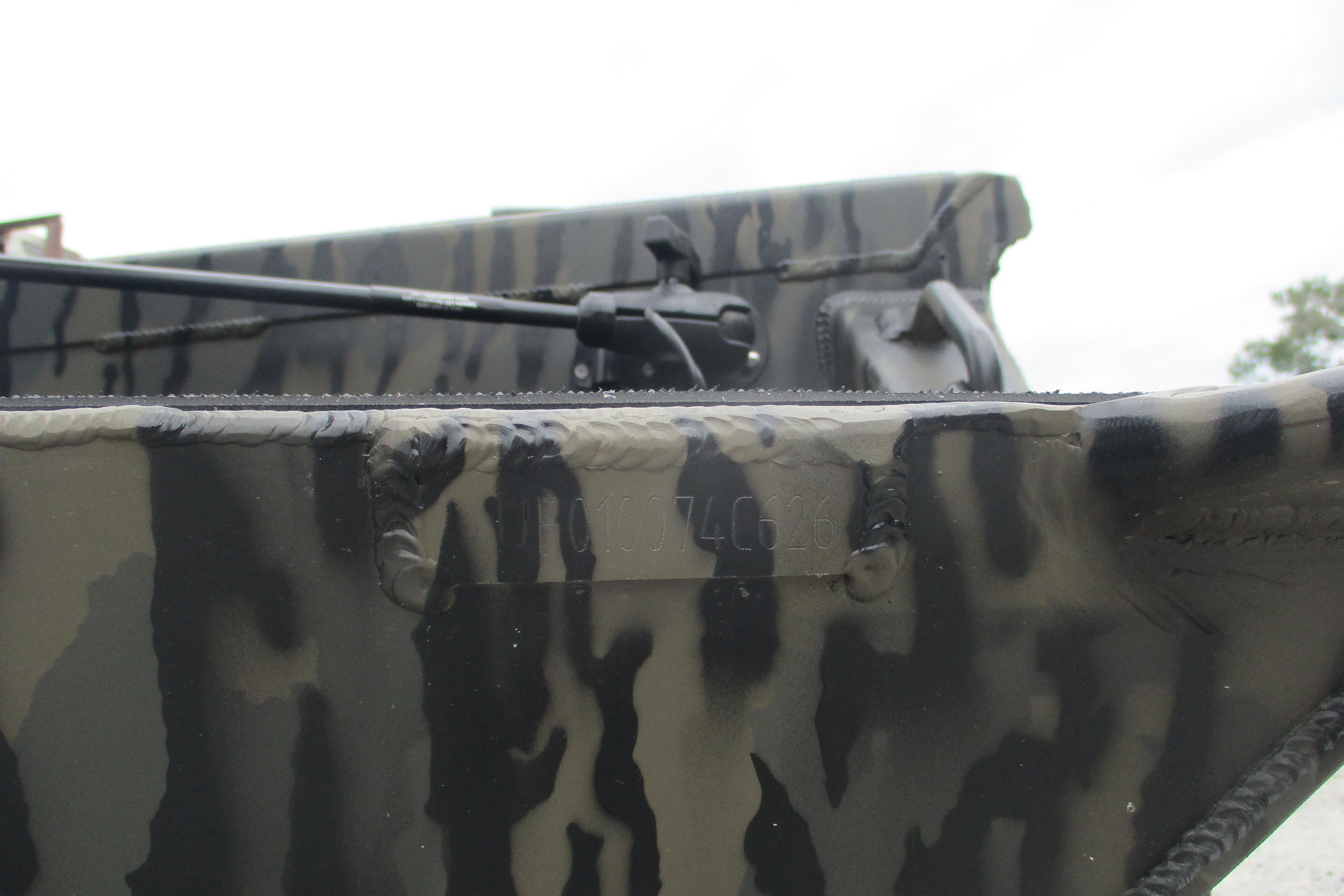 Close-up of 2026 Gator Tail 1854 Extreme boat with camouflage pattern.