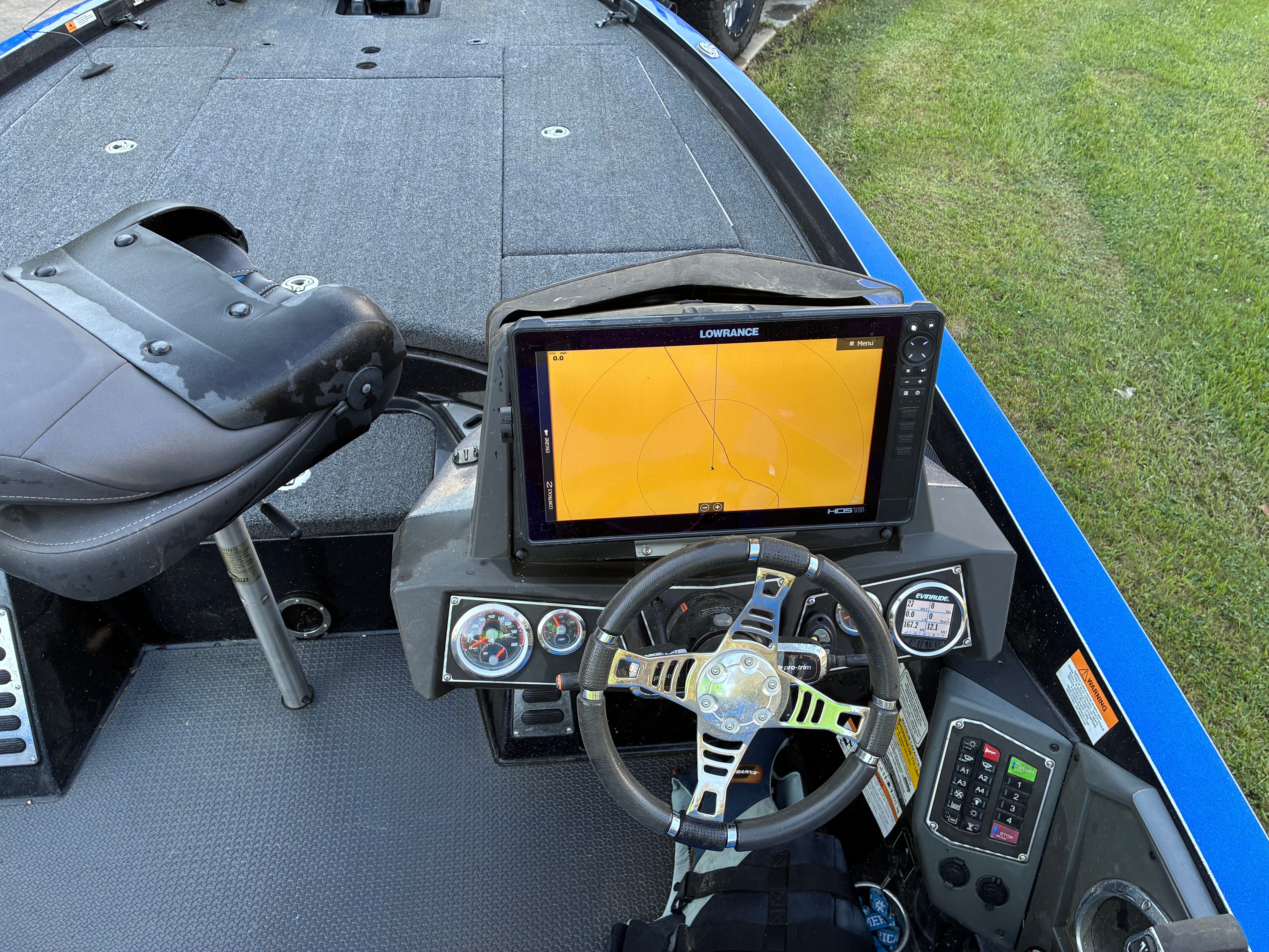 Interior of a Ranger Z521R boat with steering and electronics.