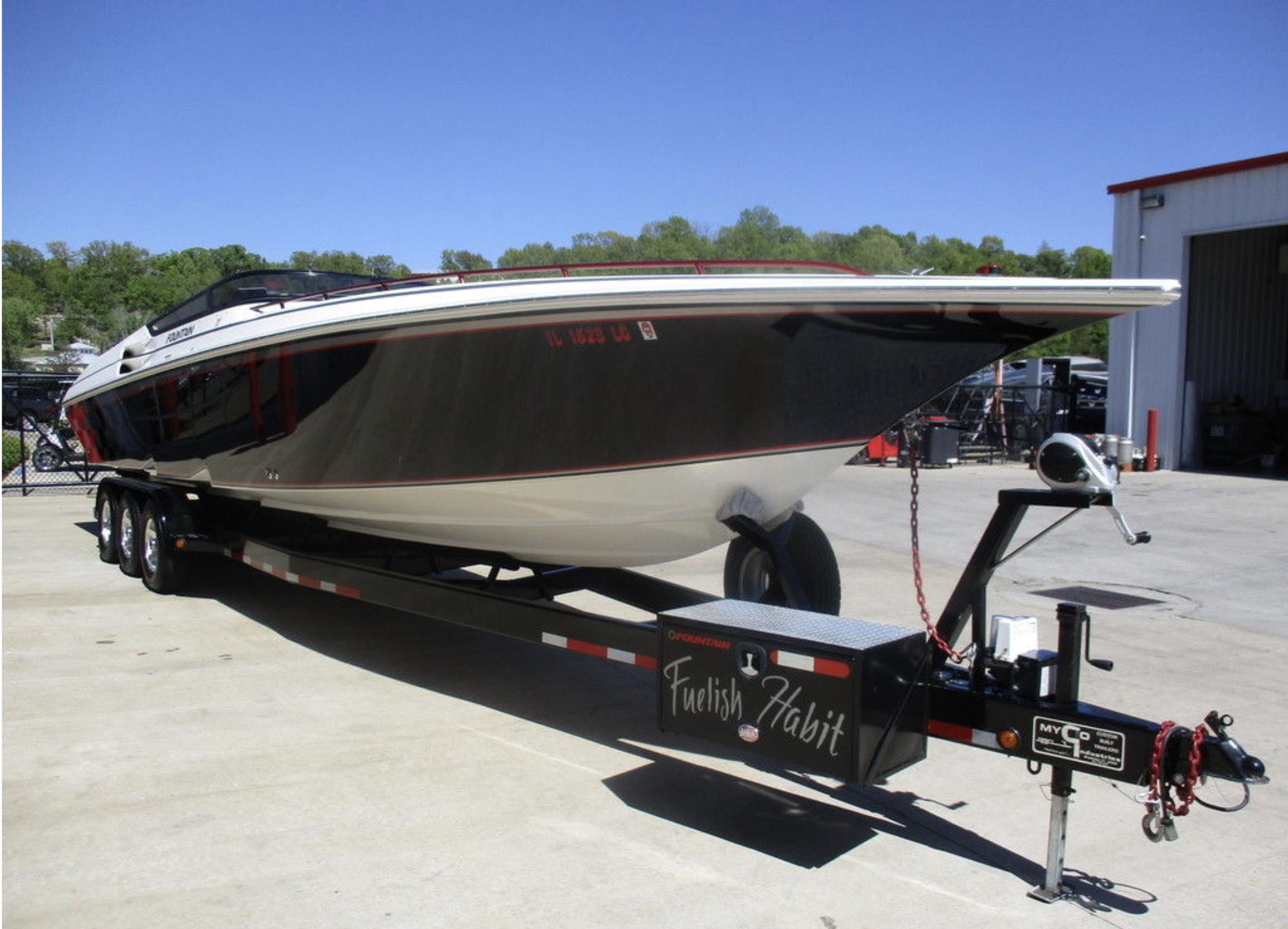 2003 Fountain 38 Lightning speedboat on a trailer.