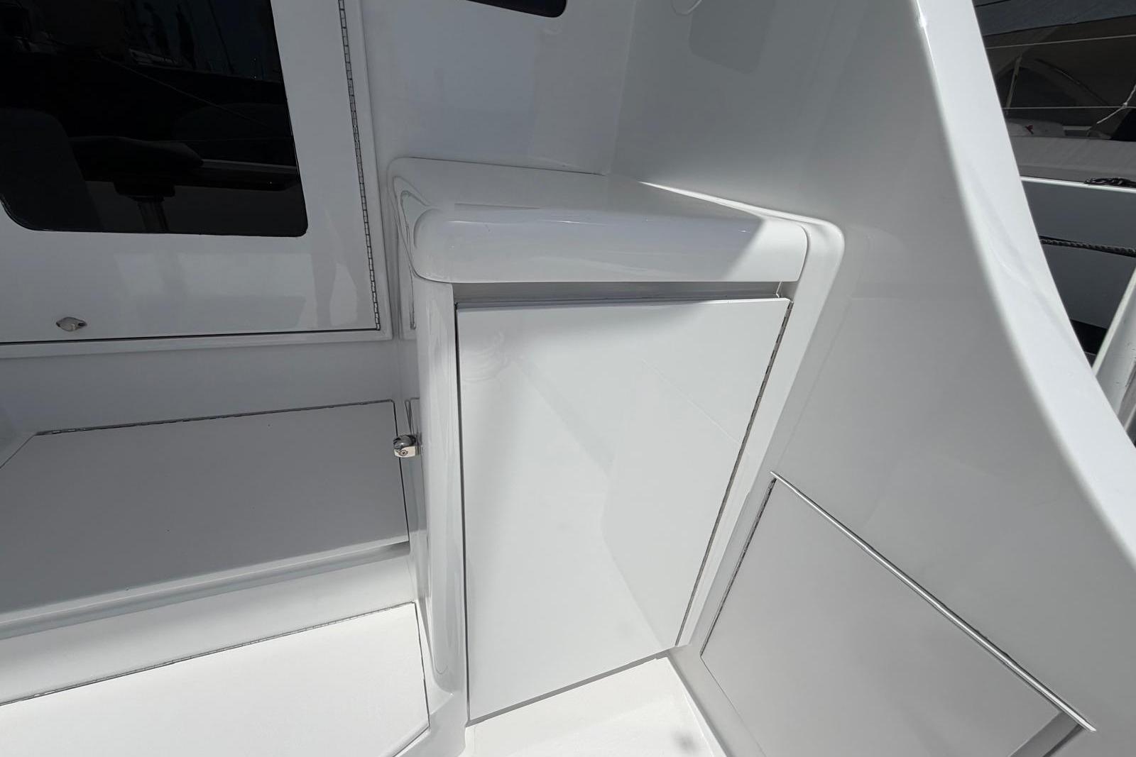 2003 Hatteras 54 Convertible yacht interior detail, featuring sleek white cabinetry.