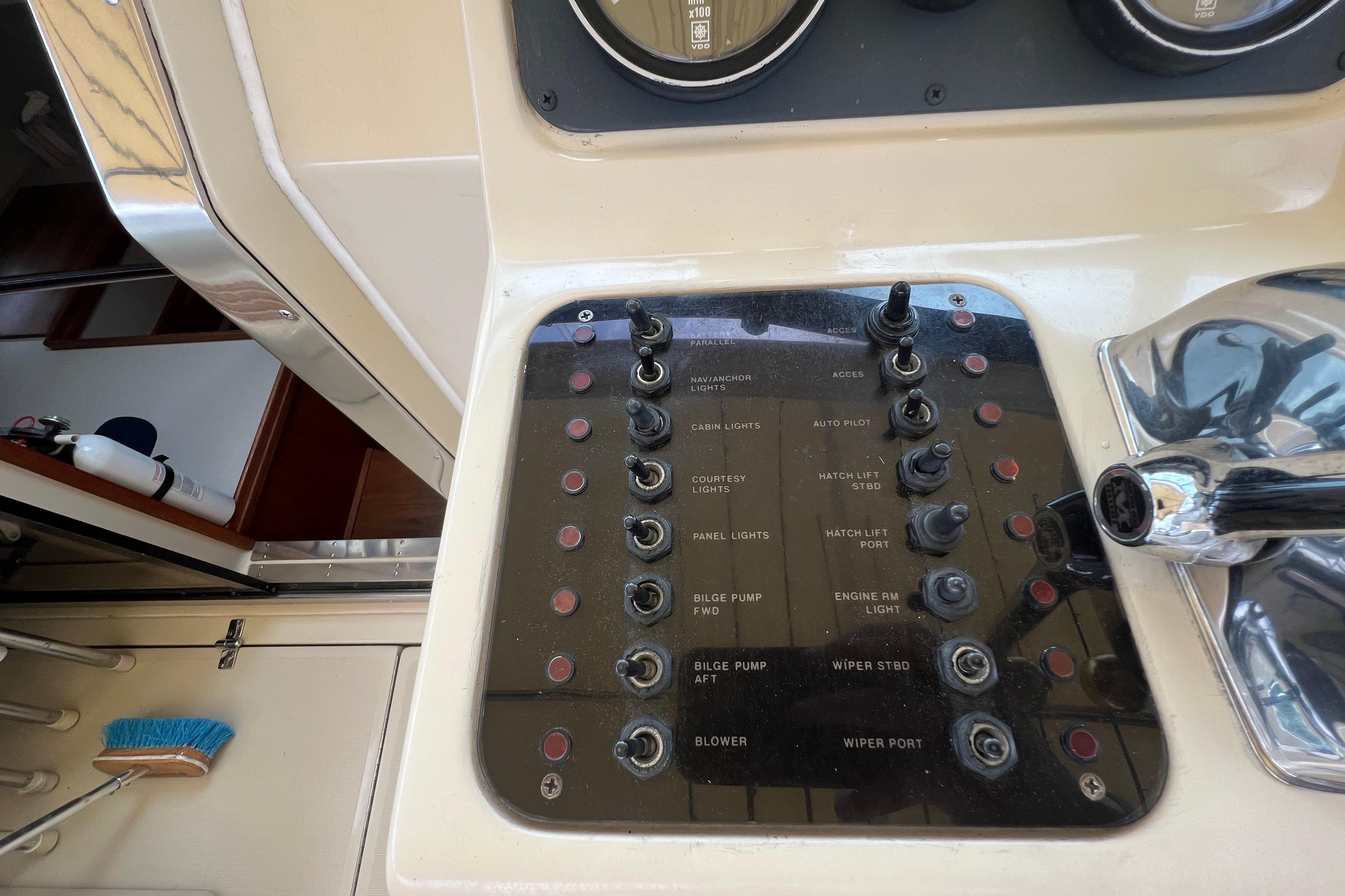 Control panel of a 1985 Tiara 36 OPEN boat with various switches and labels.