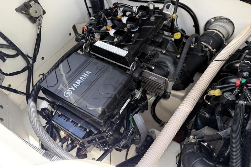 Engine compartment of a 2017 Yamaha Boats SX210, showcasing detailed mechanical components.