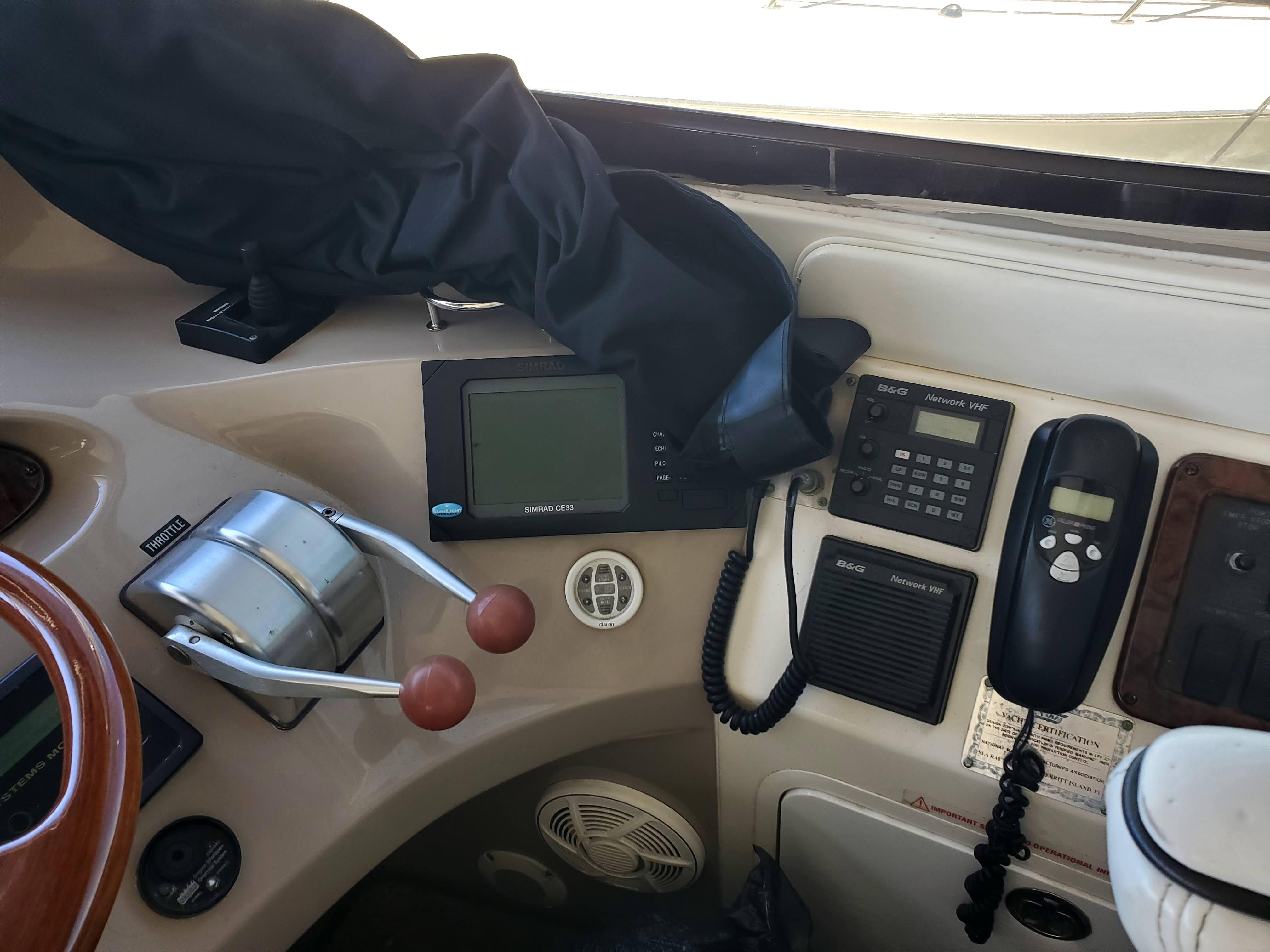 Control panel of a 2001 Sea Ray 510 Sundancer yacht with navigation and communication equipment.