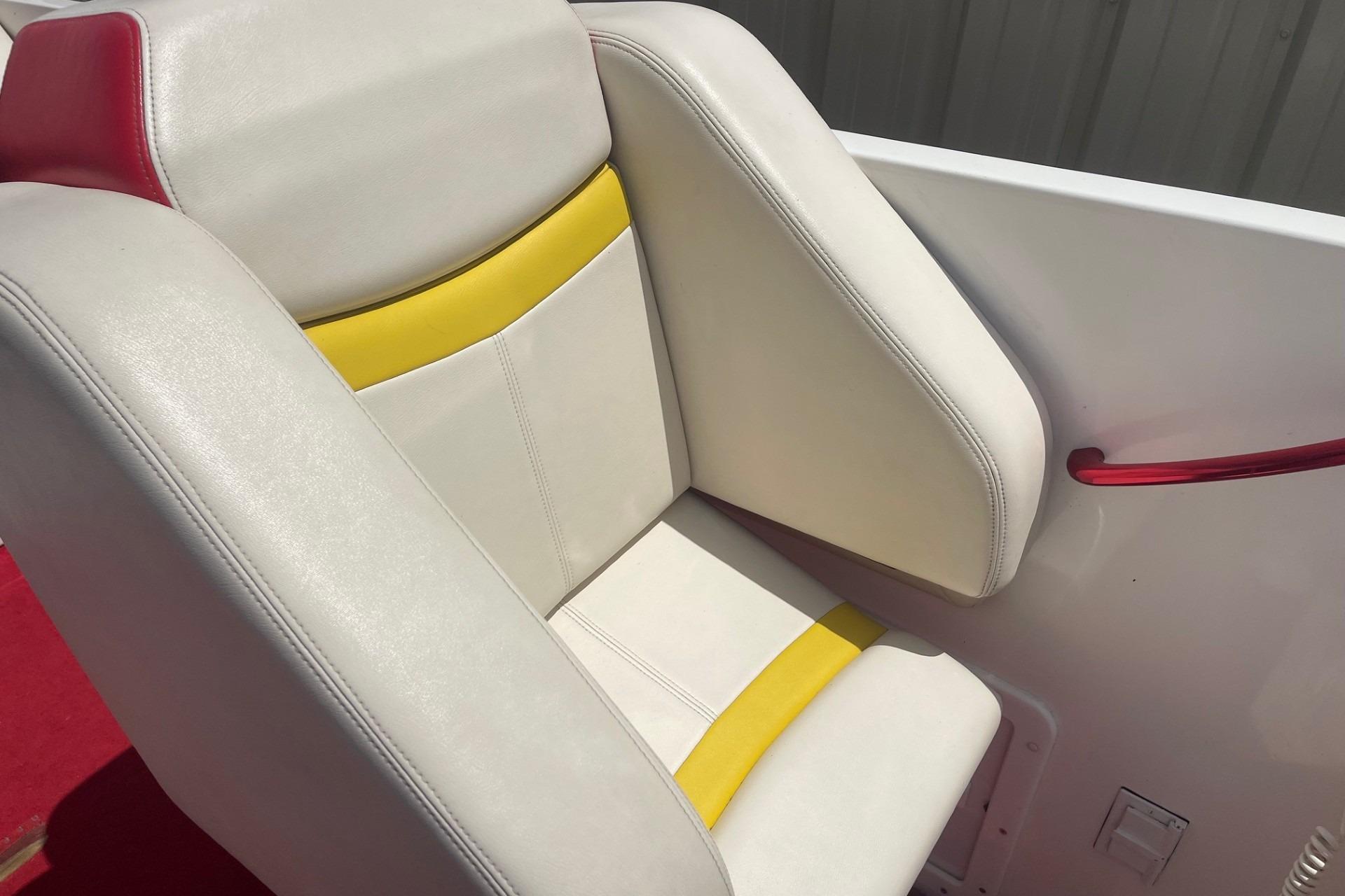 White and yellow boat seat with red accents, Sonic 386, 2006 model.