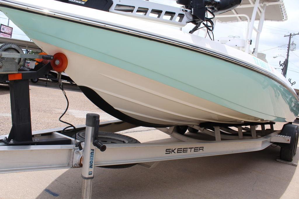 2026 Skeeter SX230 boat on trailer, showcasing sleek hull design and sturdy construction.