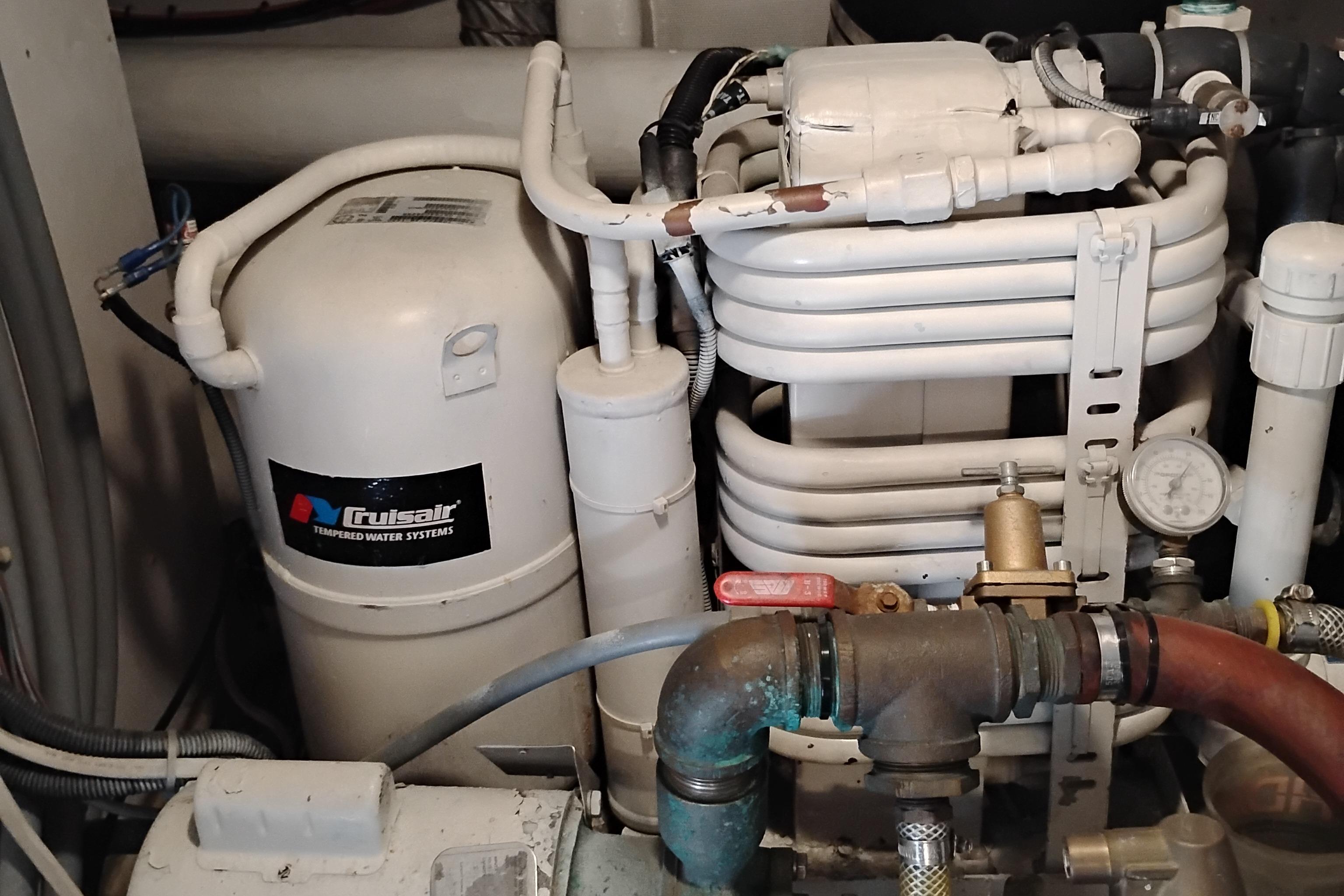 Engine room of 1995 Queenship 62 Pilothouse Motor Yacht with Cruisair system.