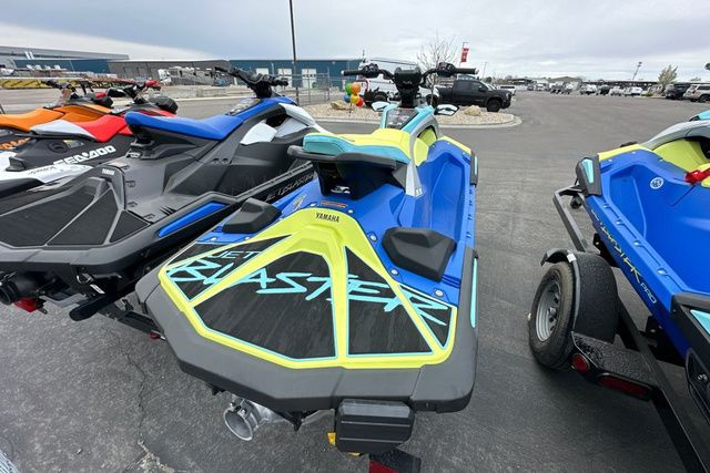 Yamaha WaveRunner JETBLASTER PRO 3 in blue and yellow on a parking lot.