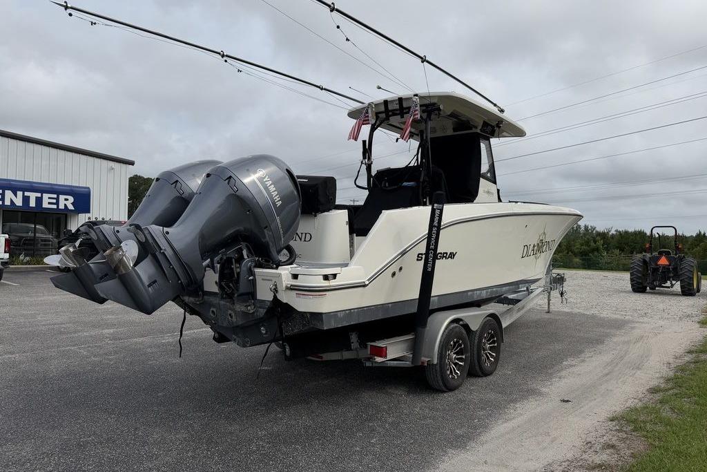 2023 Stingray 273 CC boat with dual Yamaha engines on a trailer.