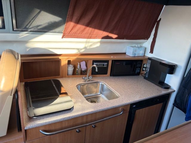 Kitchen area in a 2008 Bayliner Discovery yacht.