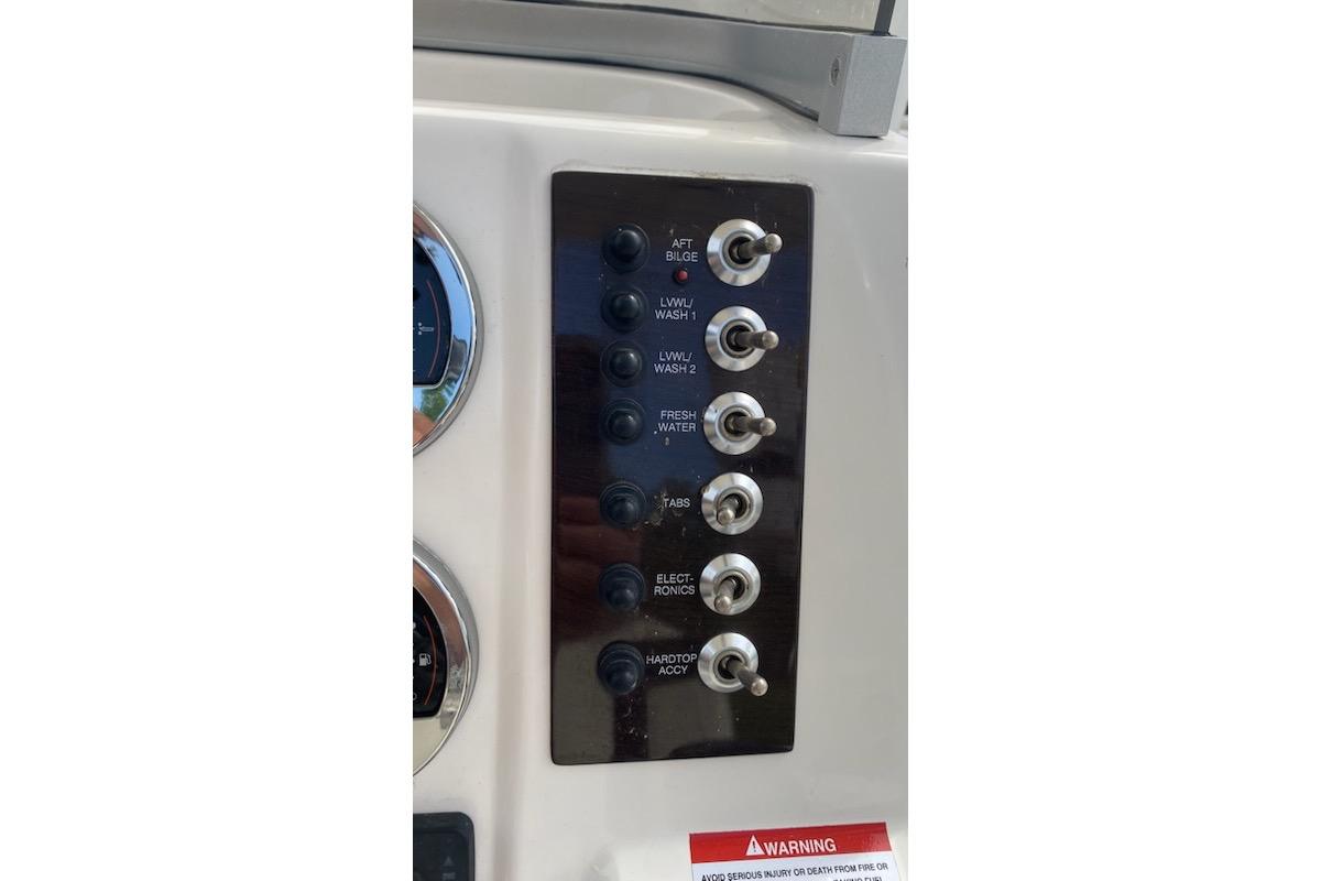 Control panel of 2017 Robalo R222 Center Console boat with labeled switches.