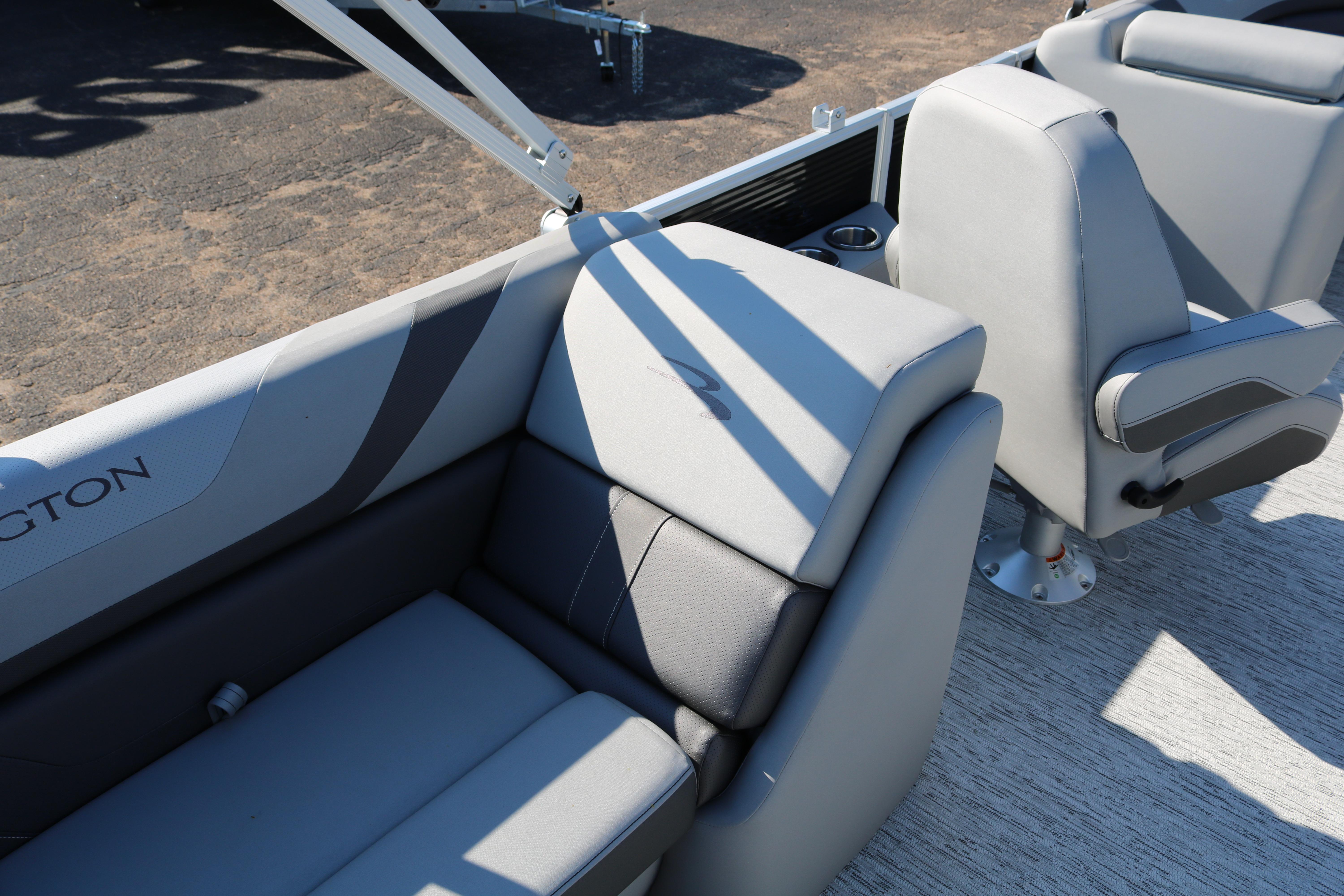 2026 Bennington 22SX Stern Radius boat interior with gray seating and cup holders.