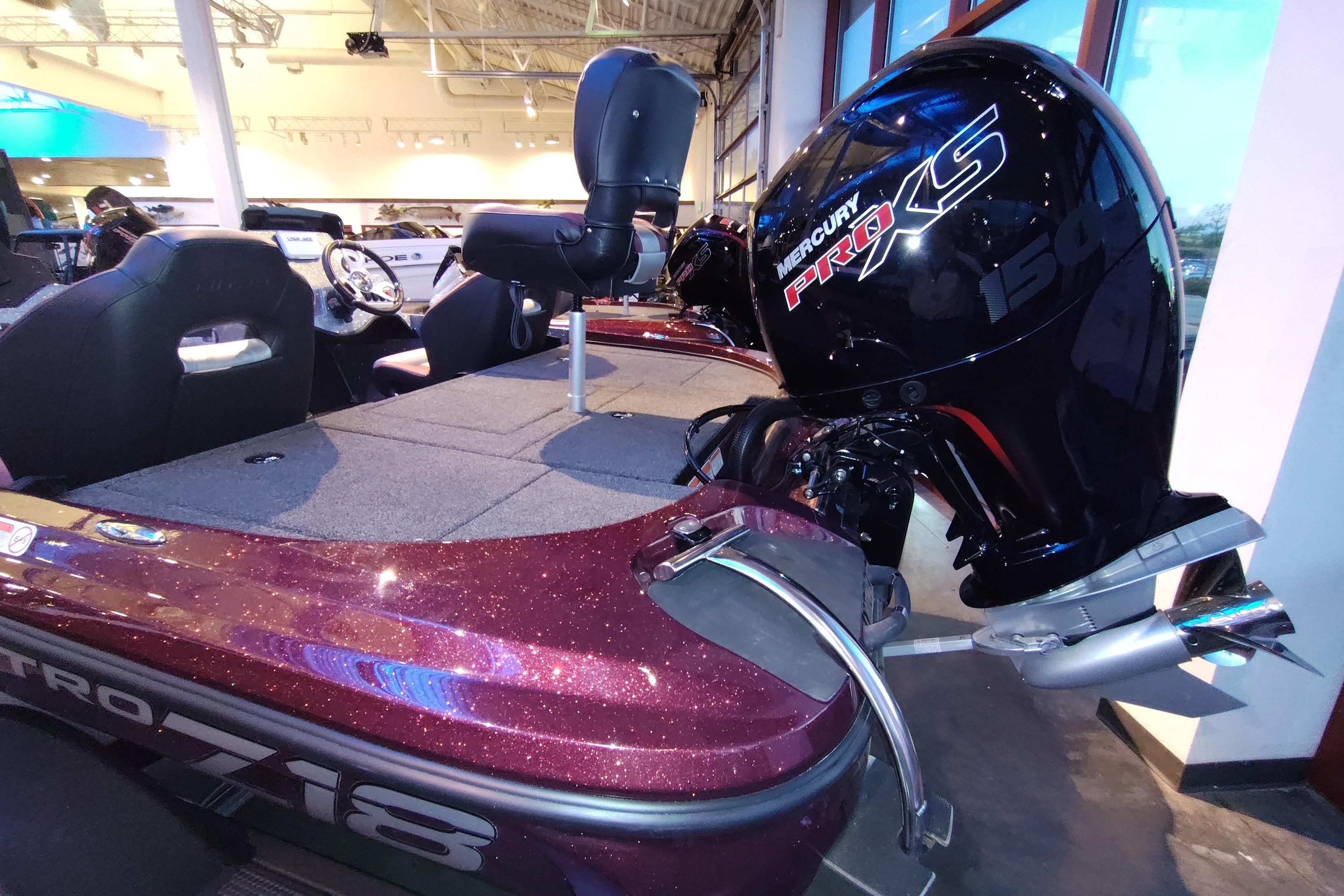 2026 Nitro Z18 boat with Mercury Pro XS 150 engine in showroom.