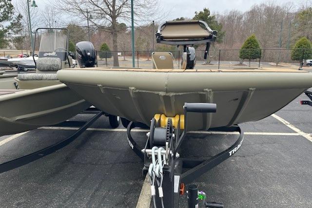 2026 Tracker Grizzly 1756 T Marsh boat on trailer in parking lot.