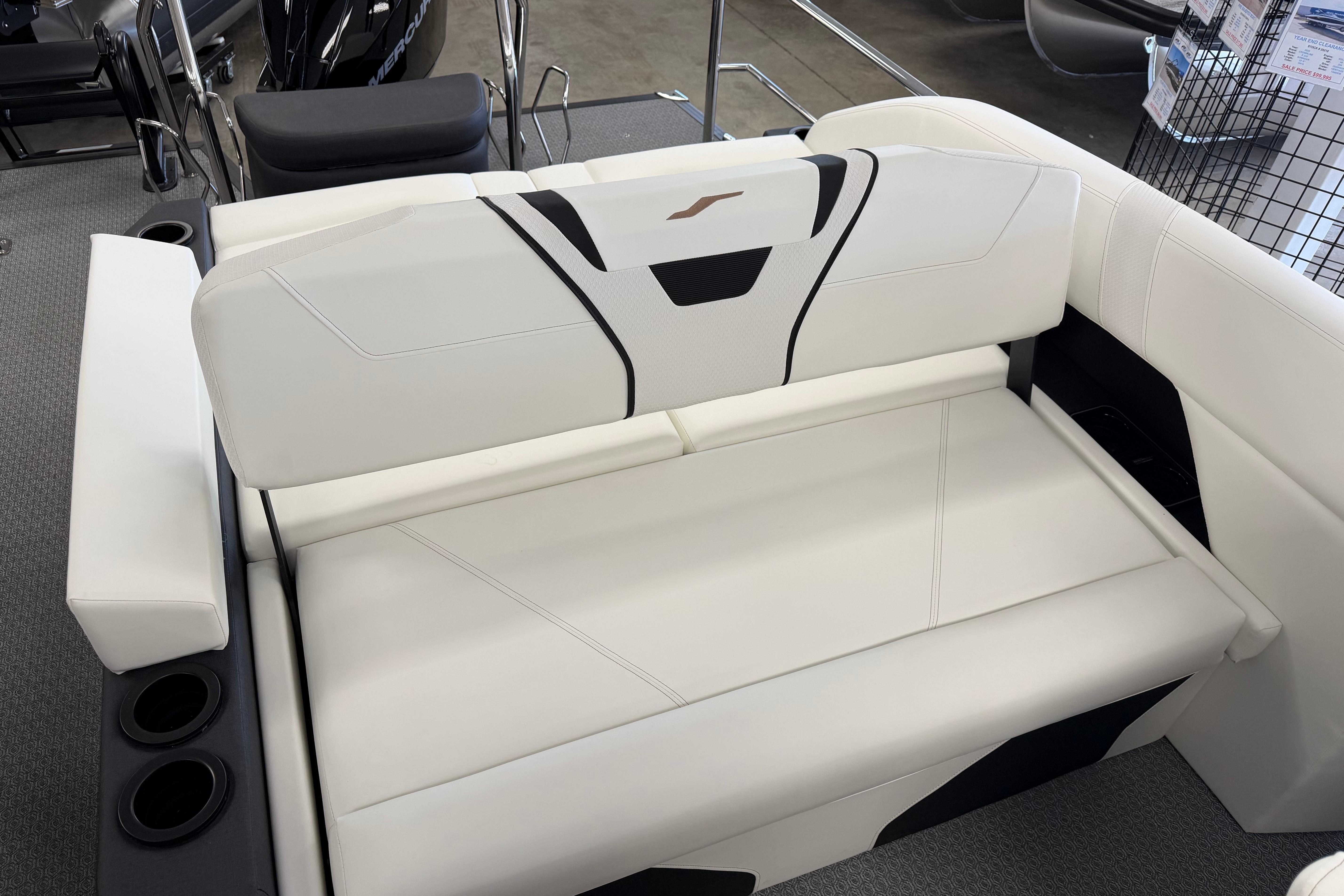 Luxury seating on 2026 Evotti 721CS boat, featuring sleek white upholstery and integrated cup holders.