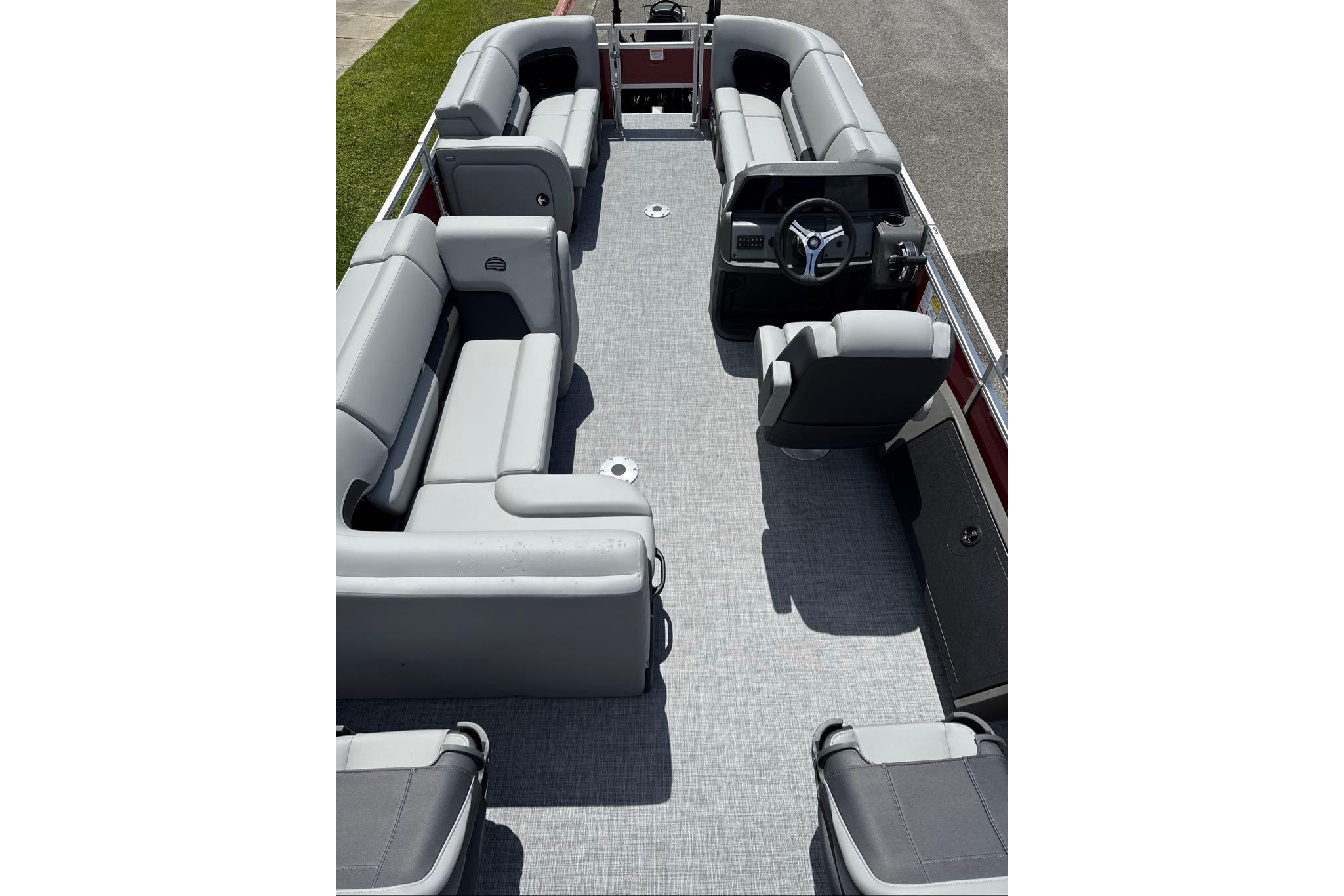 2026 Sun Tracker SportFish 22 DLX pontoon boat interior with spacious seating and modern helm.