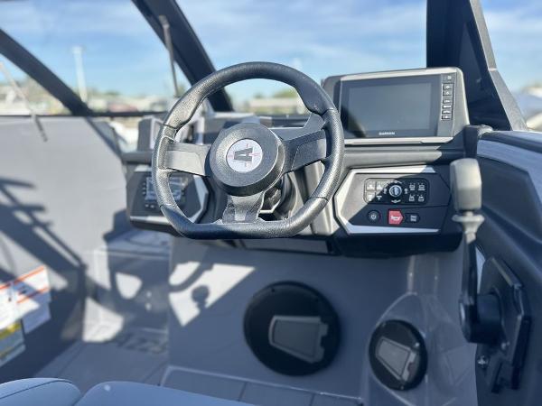 2025 Axis A225 boat dashboard with steering wheel and control panel.