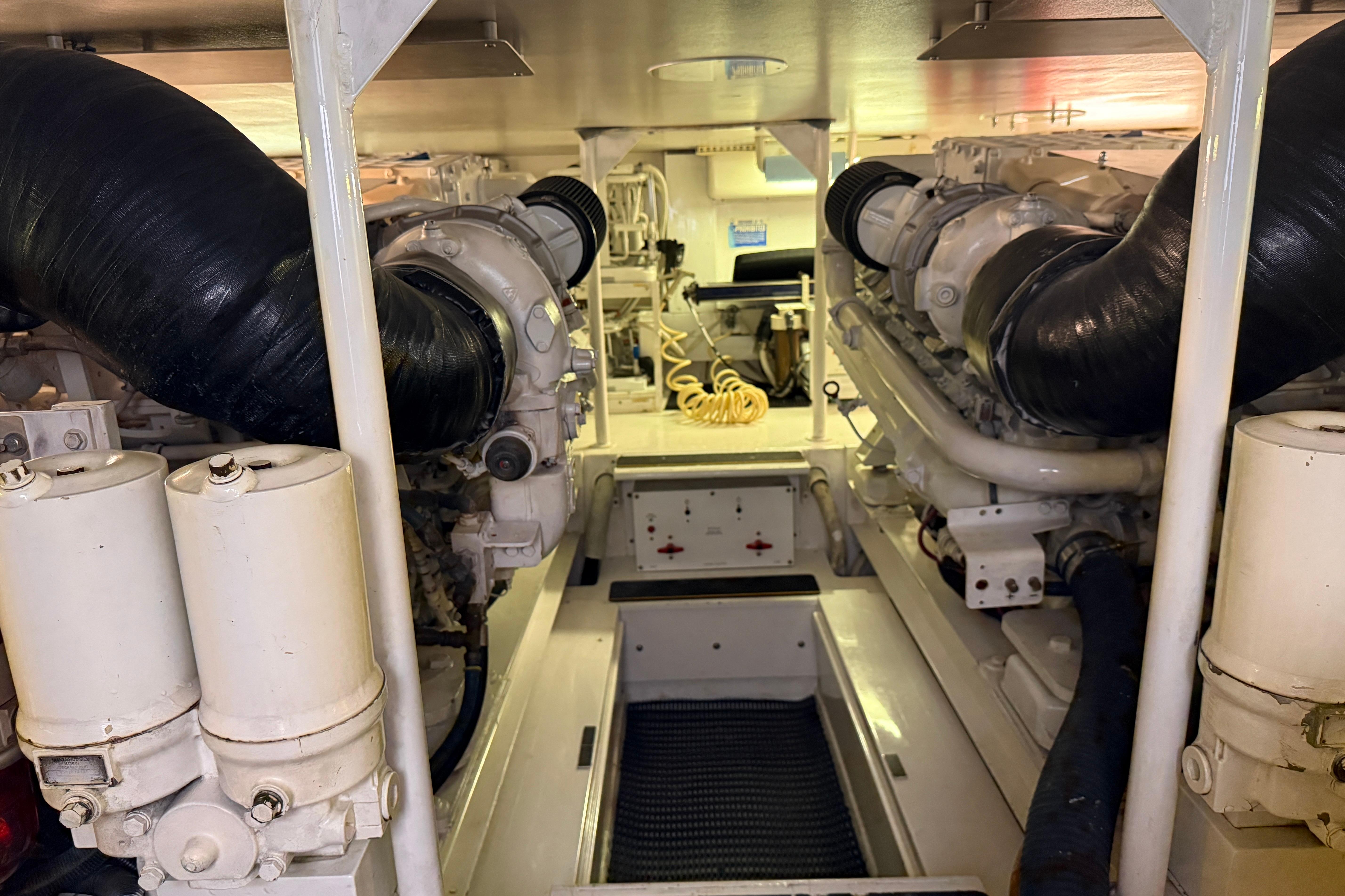 Engine room of a 2000 Viking 55 Convertible with two large engines.