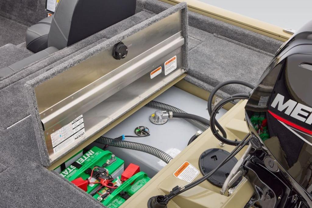 2026 Tracker Pro Team 175 boat interior with open storage compartment and visible engine.