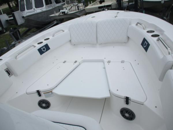 2025 Sea Fox 228 Commander boat interior with white seating and cup holders.