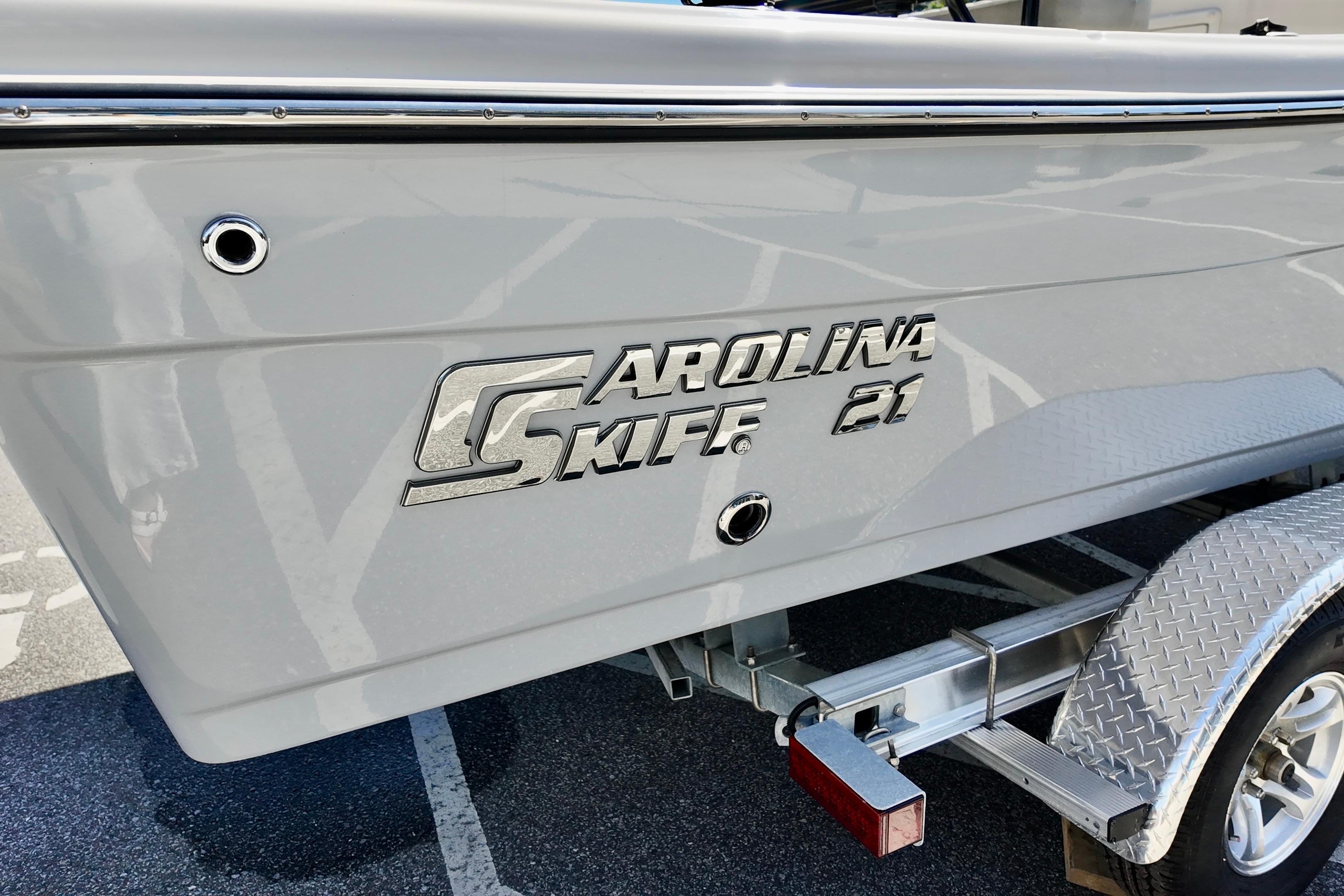 2026 Carolina Skiff 21 Ultra Elite boat on trailer, side view.