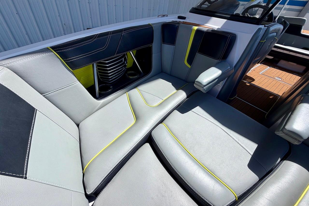 2014 Nautique Super Air Nautique G21 interior with sleek gray seating and vibrant accents.