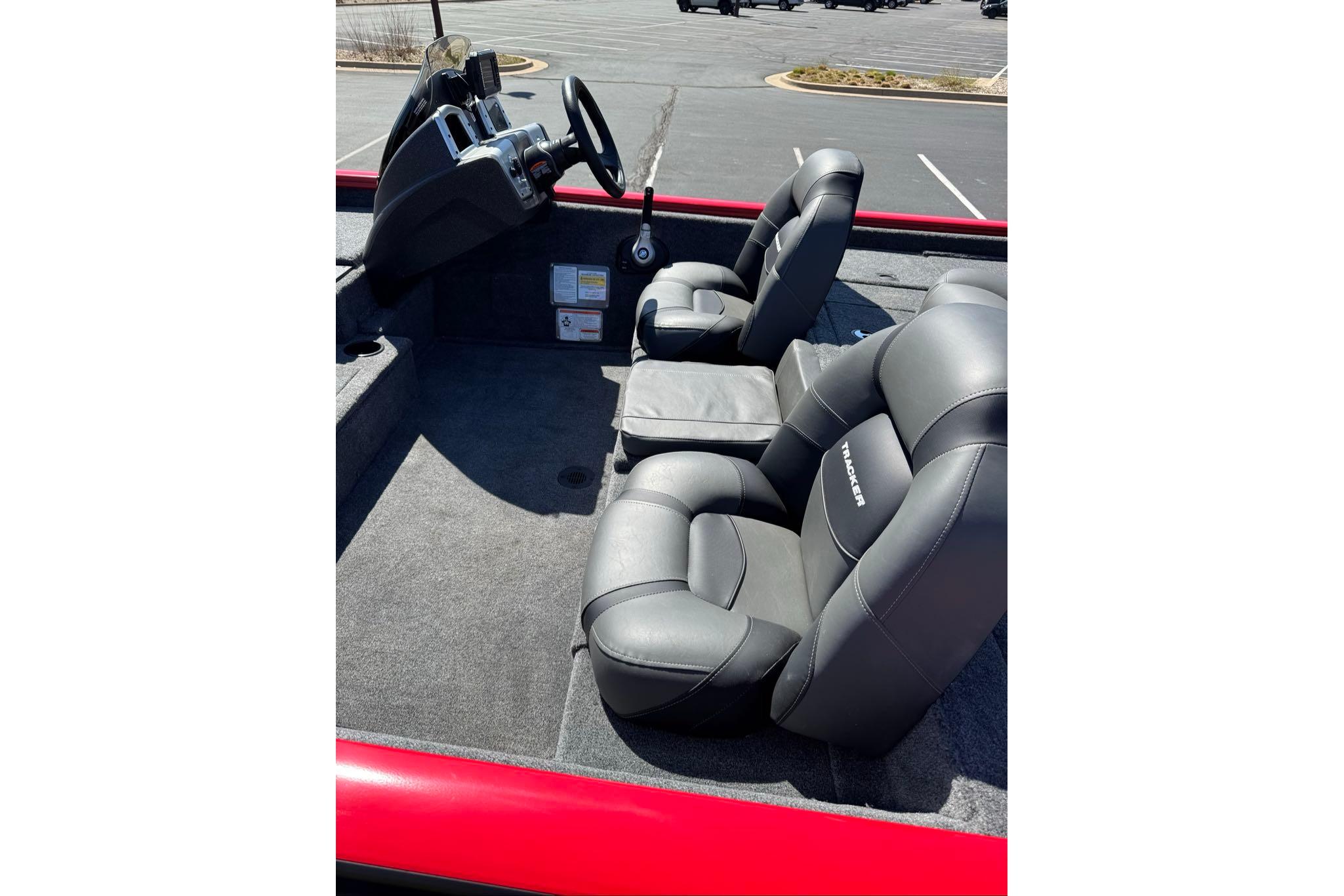 2026 Tracker Pro Team 195 boat interior with gray seating and steering console.
