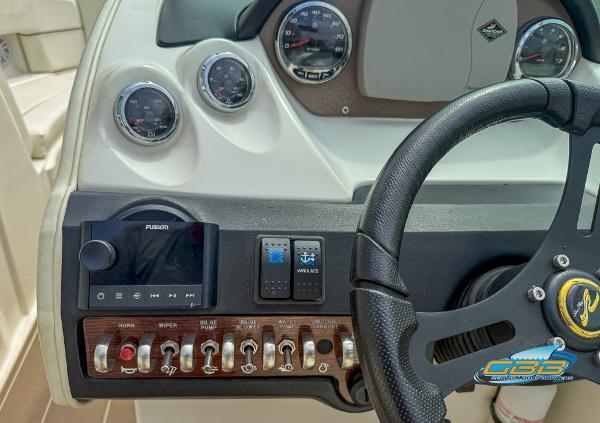Dashboard of 2008 Sea Ray 270 SLX boat with steering wheel and control panel.