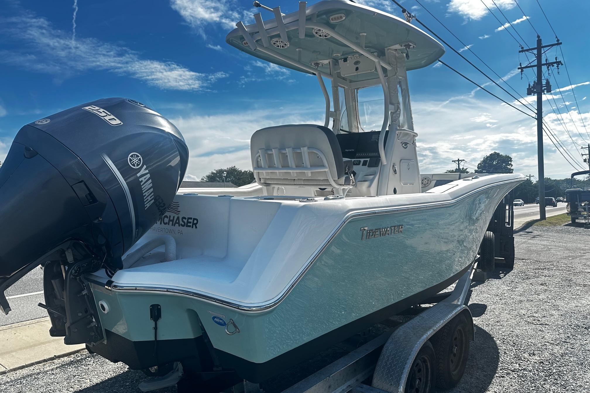 2020 Tidewater 230 CC Adventure boat with Yamaha 250 engine on trailer, under blue sky.