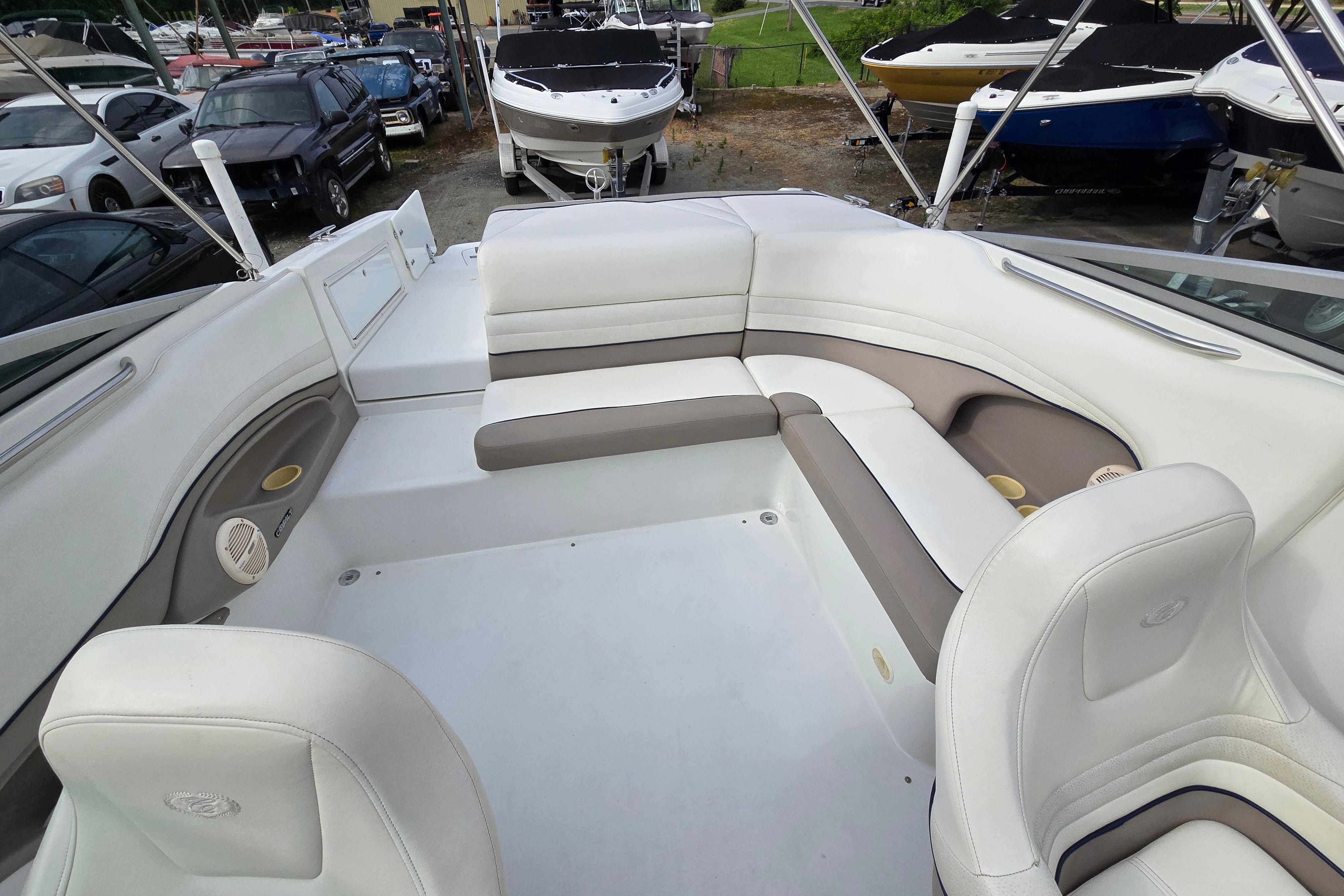 Interior of a 2000 Cobalt 246 boat with white and beige seating.