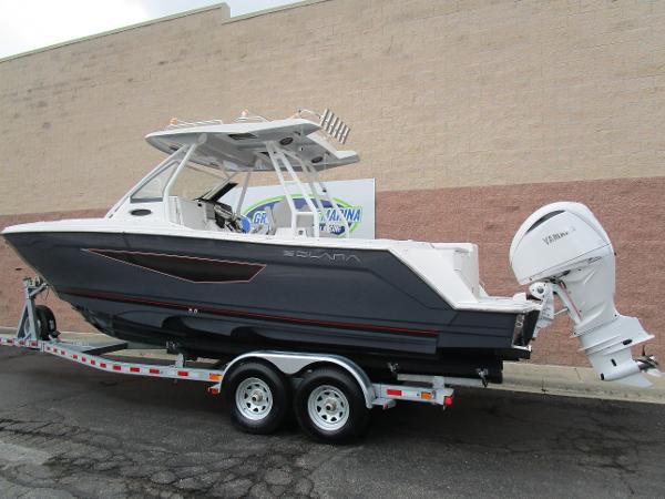2025 Solara S-250 CW boat on trailer, side view, parked outdoors.