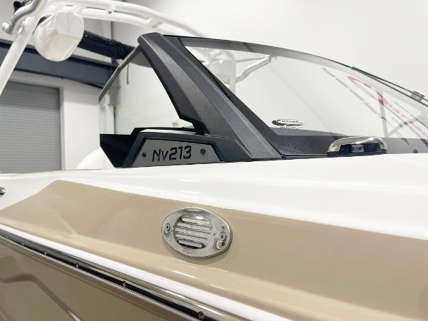 Centurion NV213 2025 boat, close-up of windshield and side detail in showroom.