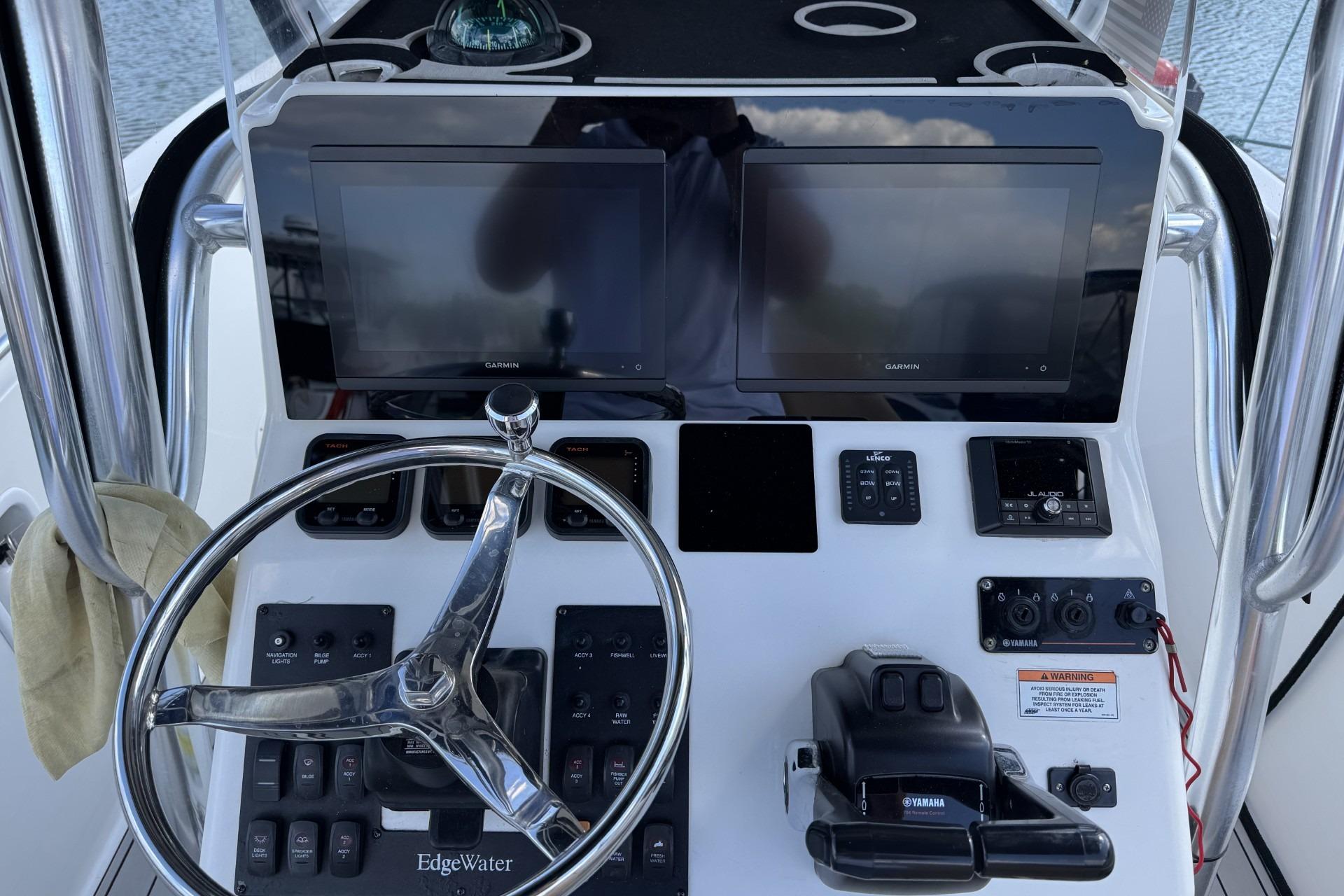 Helm of 2007 Edgewater 245CC boat with Garmin displays and Yamaha controls.