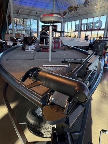 2025 Ranger ALPHA 208 fishing boat in showroom, featuring advanced equipment and sleek design.