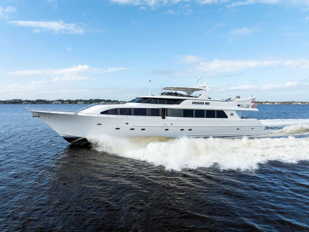 1999 Westport 112 luxury yacht cruising on open water.