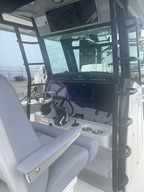Interior view of 2023 Boston Whaler 330 Outrage cockpit.