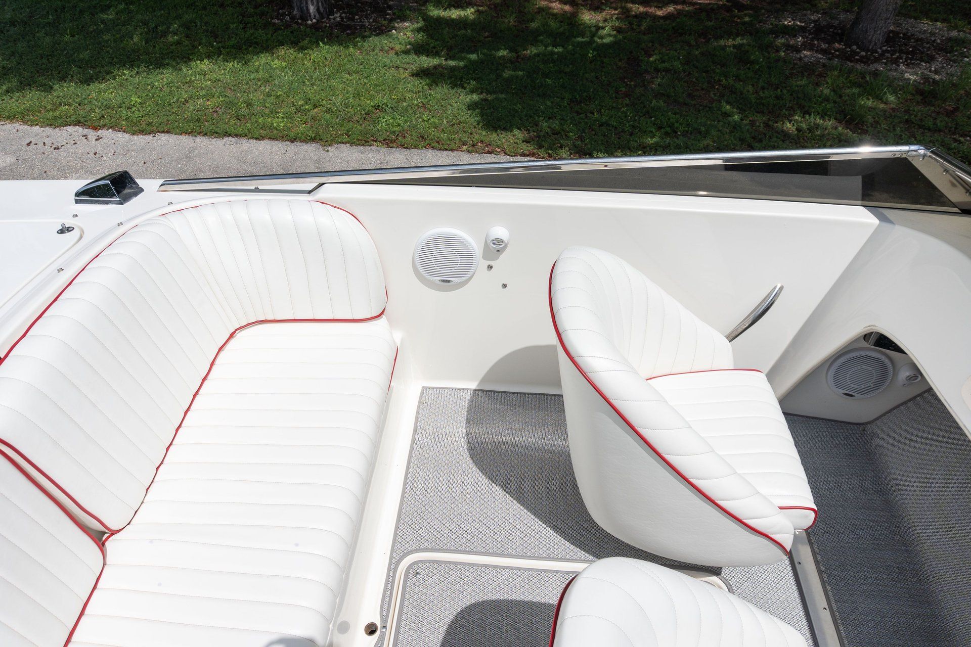 Interior view of a 1995 Donzi Classic with white seats and red accents.