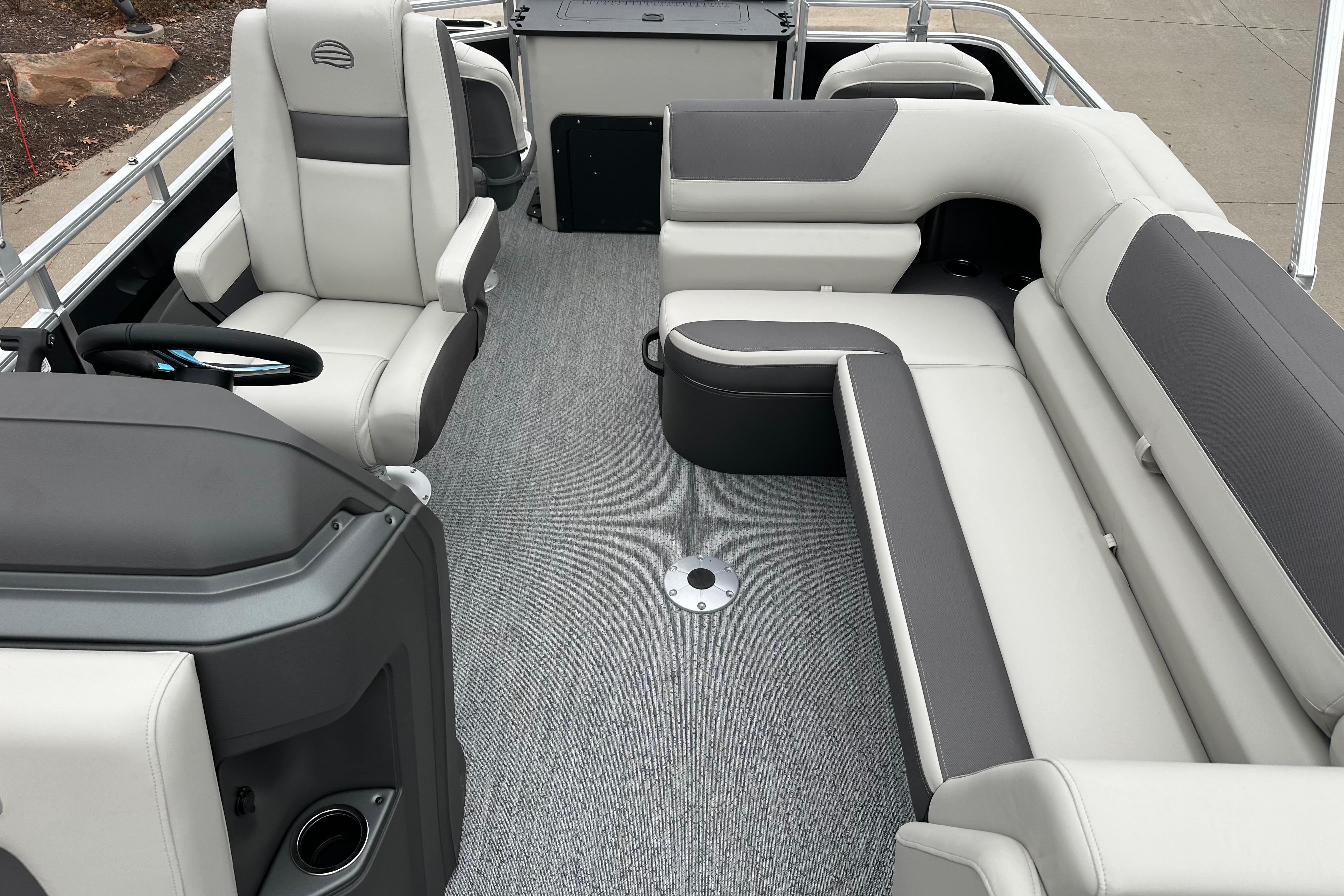2026 Sun Tracker Fishin' Barge 22 DLX interior with plush seating and modern design.