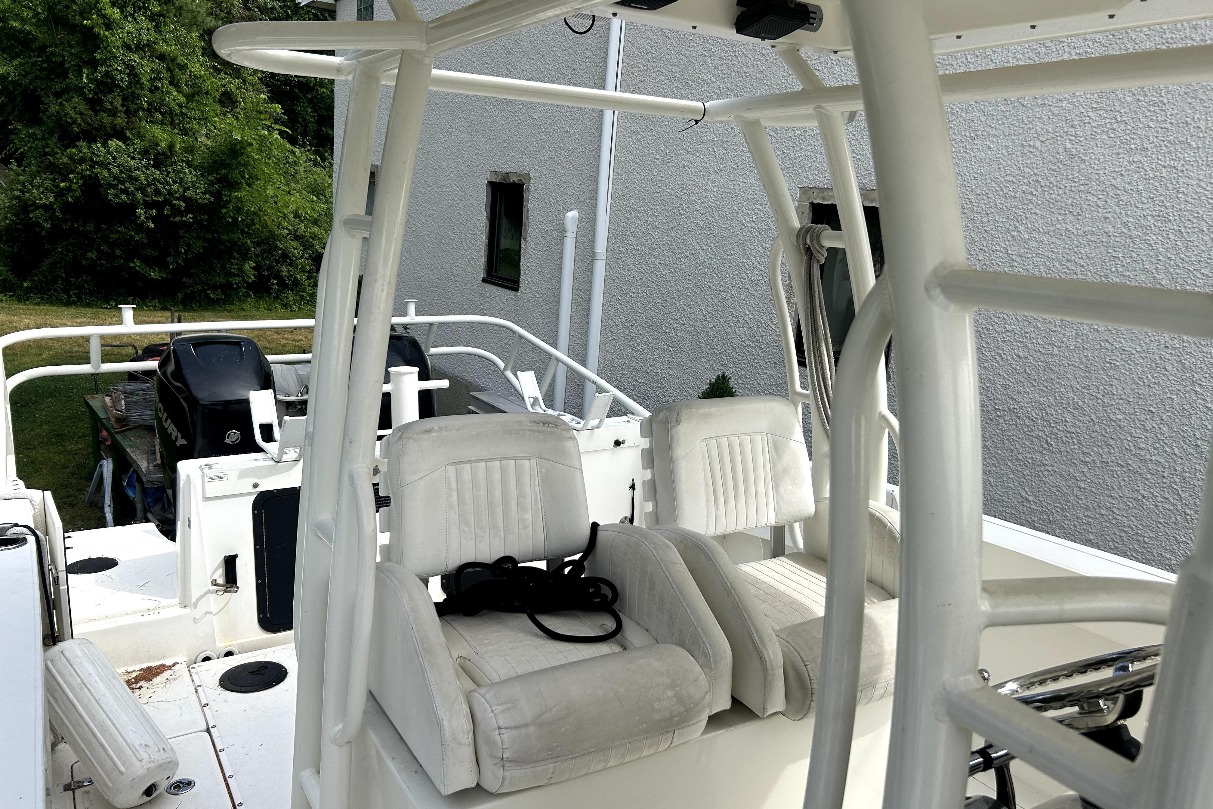 2012 Boston Whaler 320 Outrage boat interior with white seating and sturdy framework.