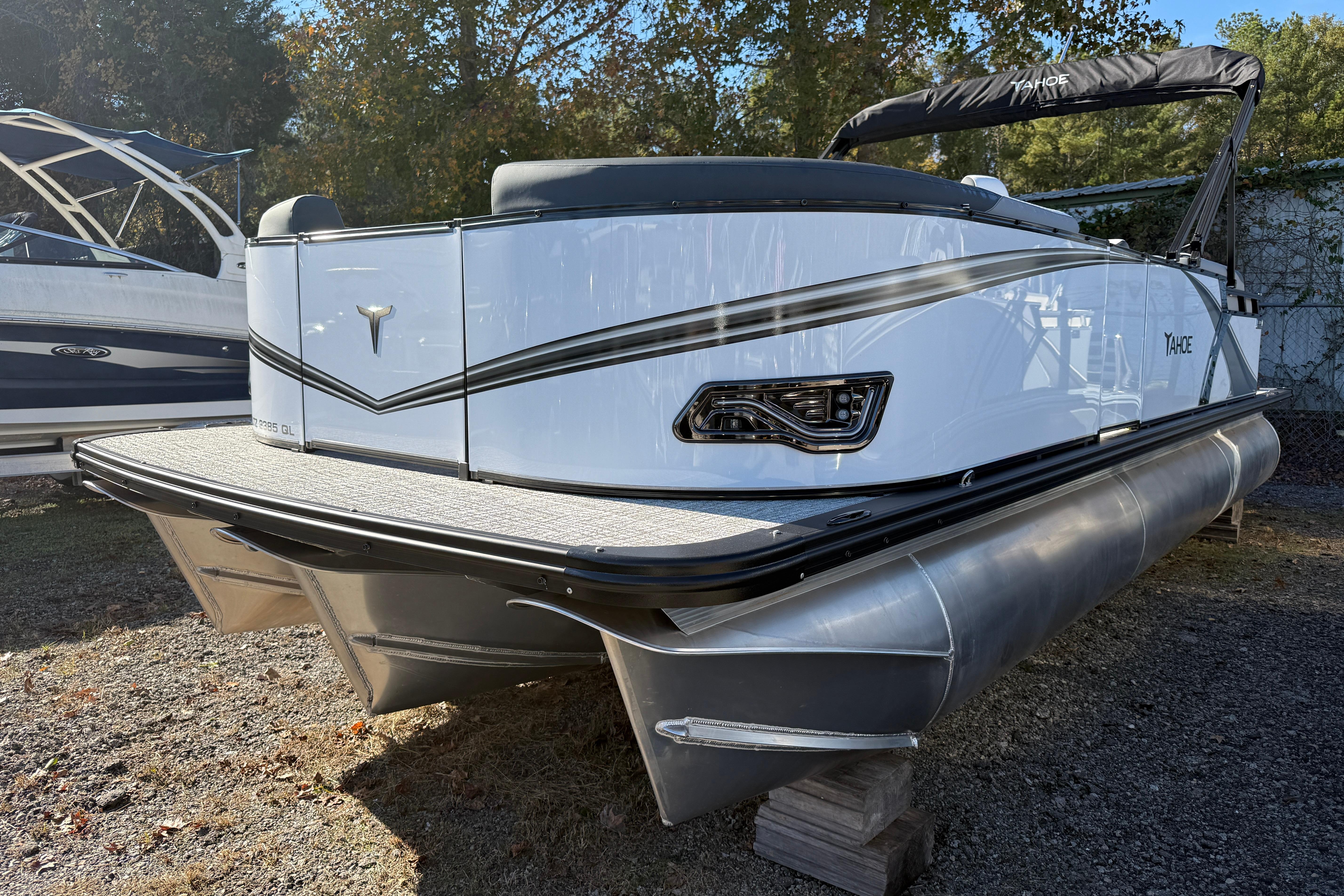2026 Tahoe Pontoon LTZ Quad Lounger, sleek design, parked outdoors.
