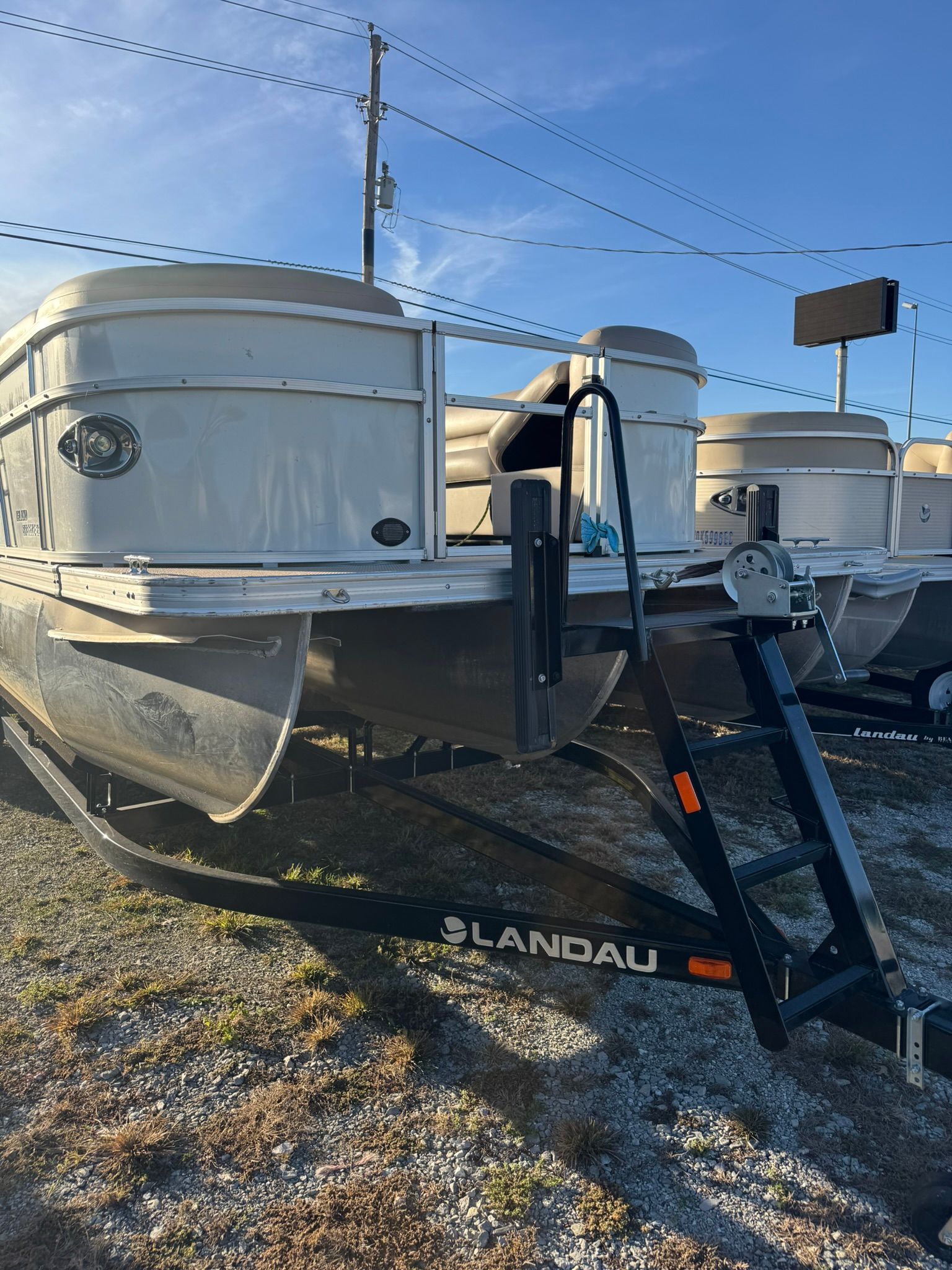 2024 Landau Island Breeze 252 pontoon boat on trailer.